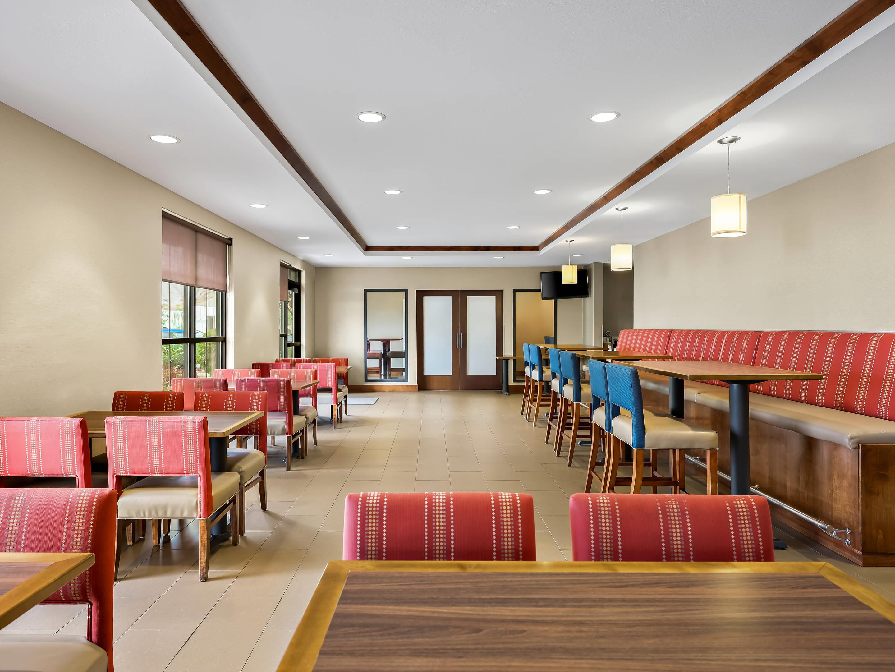 Enjoy breakfast in this seating area | Comfort Suites Moab near Arches National Park