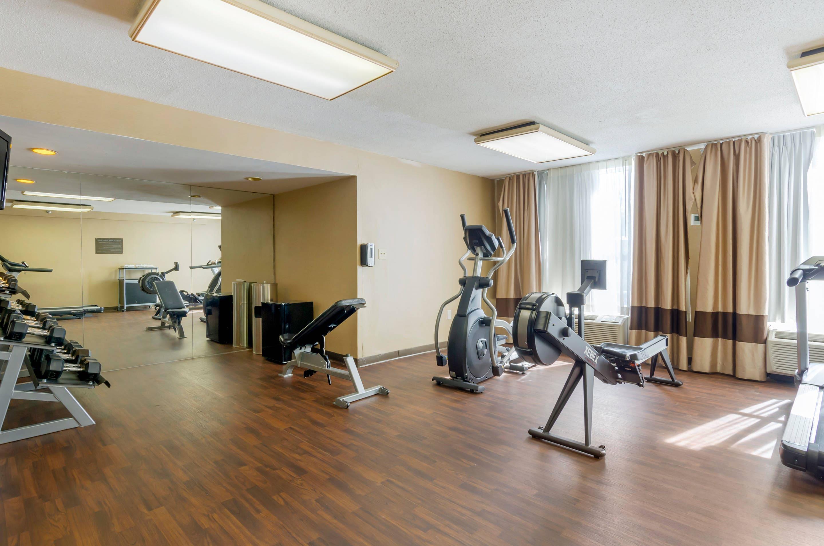 Exercise room with cardio equipment and weights | Comfort Inn Blacksburg University Area