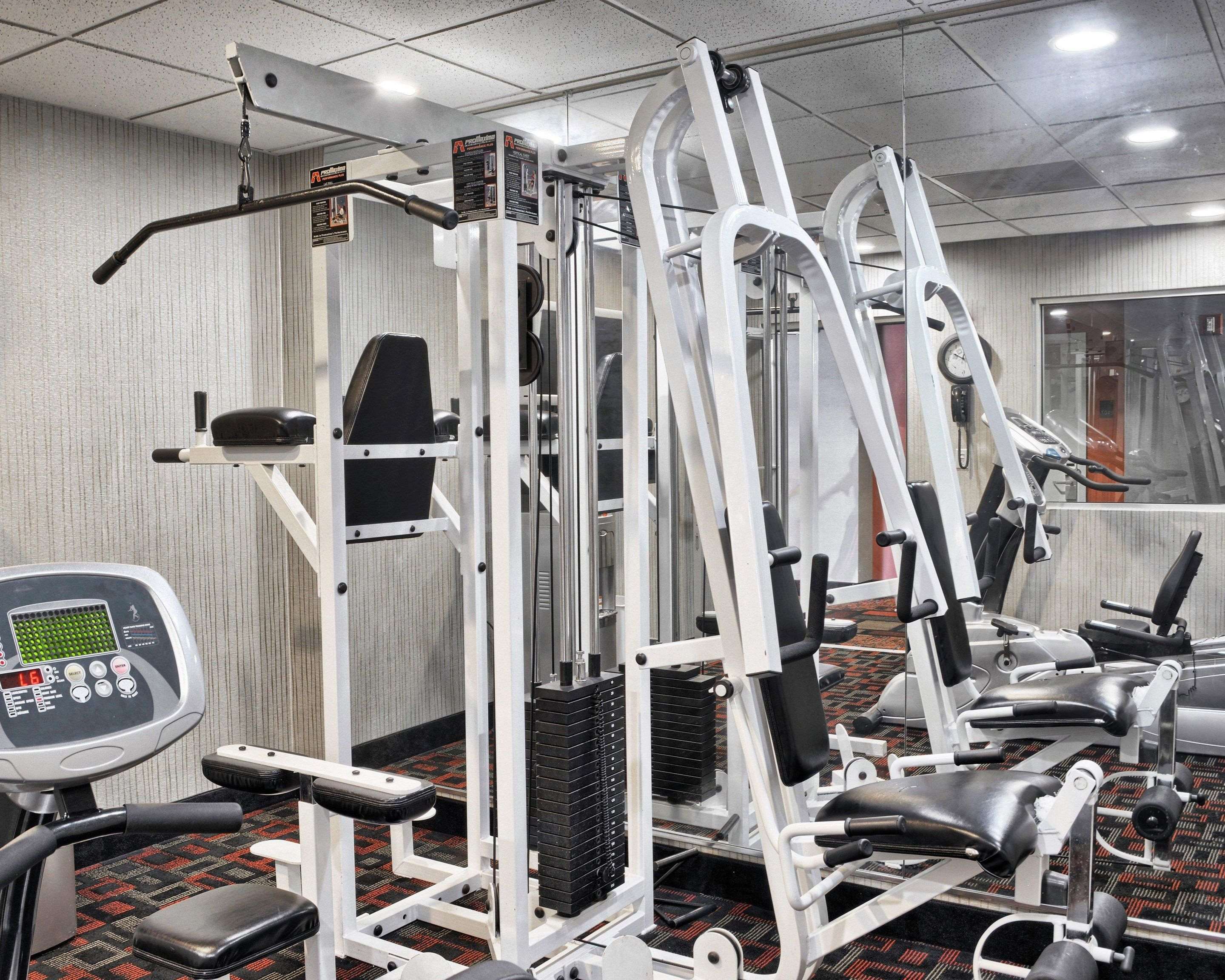 Exercise room with cardio equipment and weights