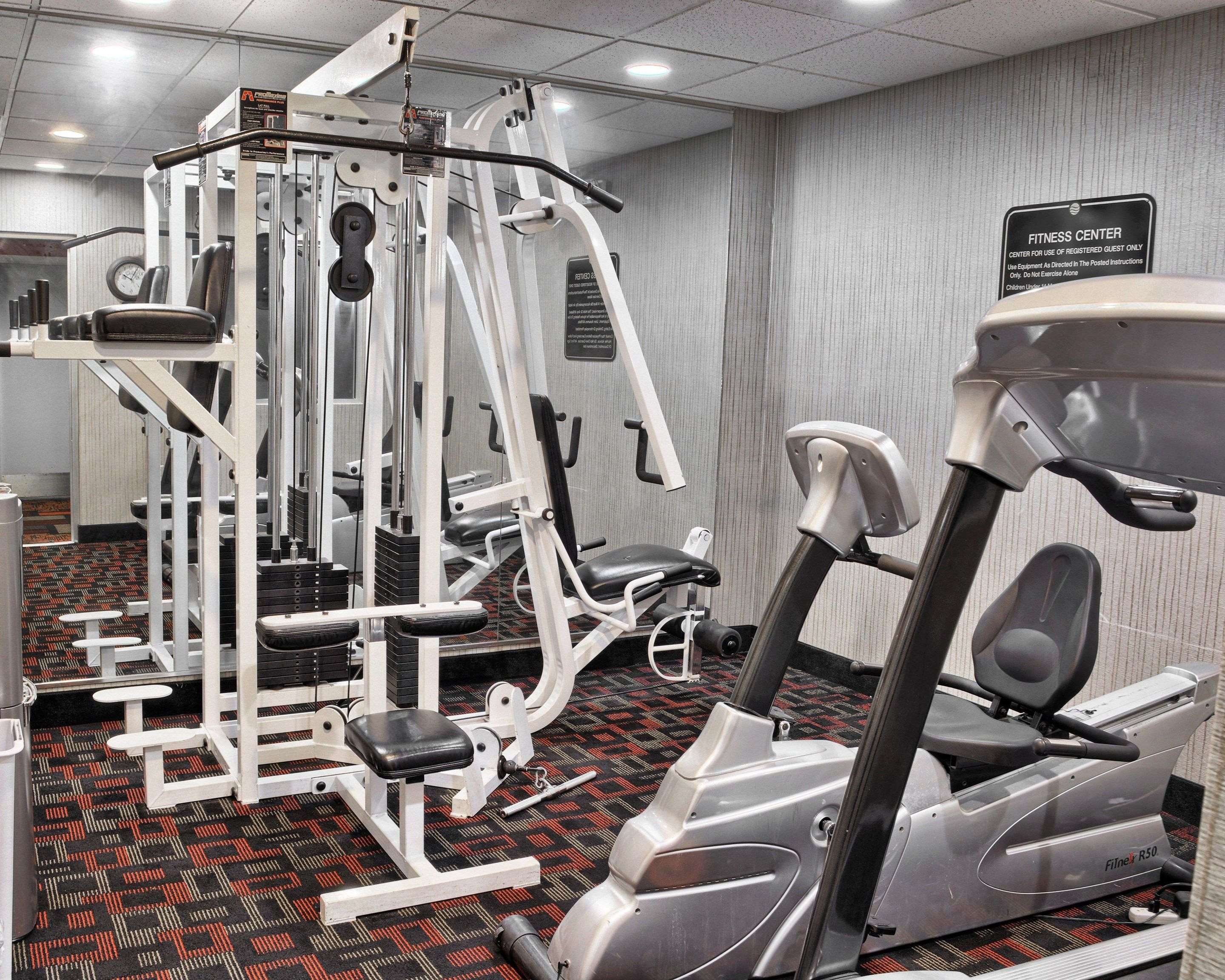 Exercise room with cardio equipment and weights