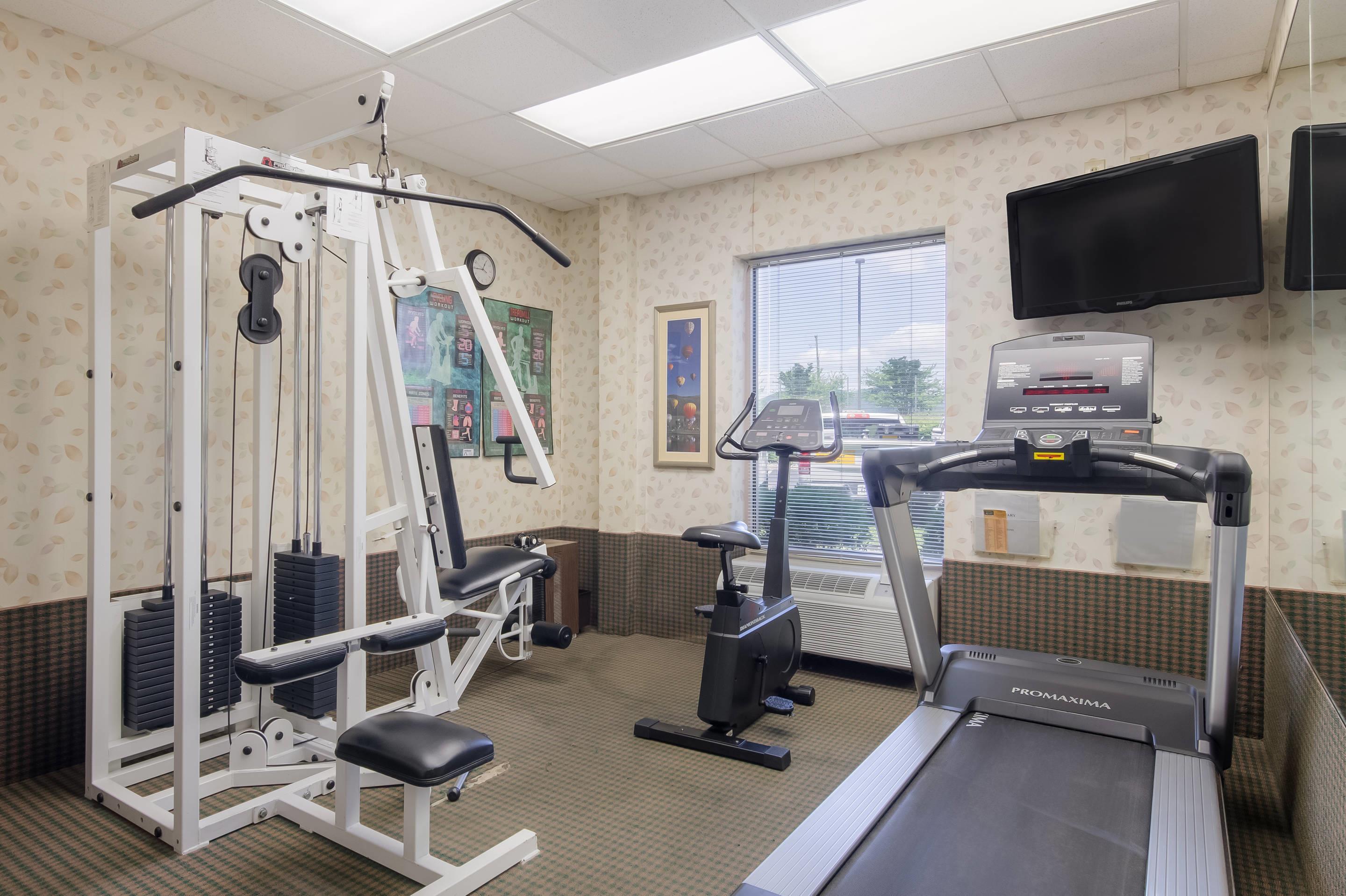 Exercise room with cardio equipment | Mainstay Suites Airport
