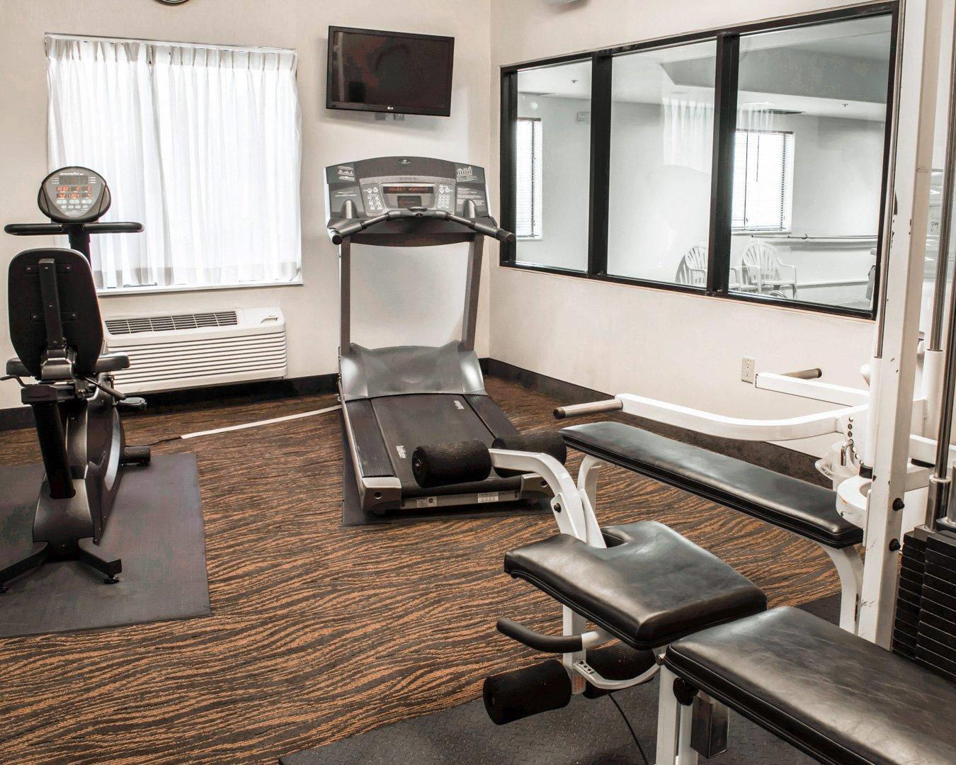 Fitness center with cardio equipment and weights | Sleep Inn & Suites Monticello