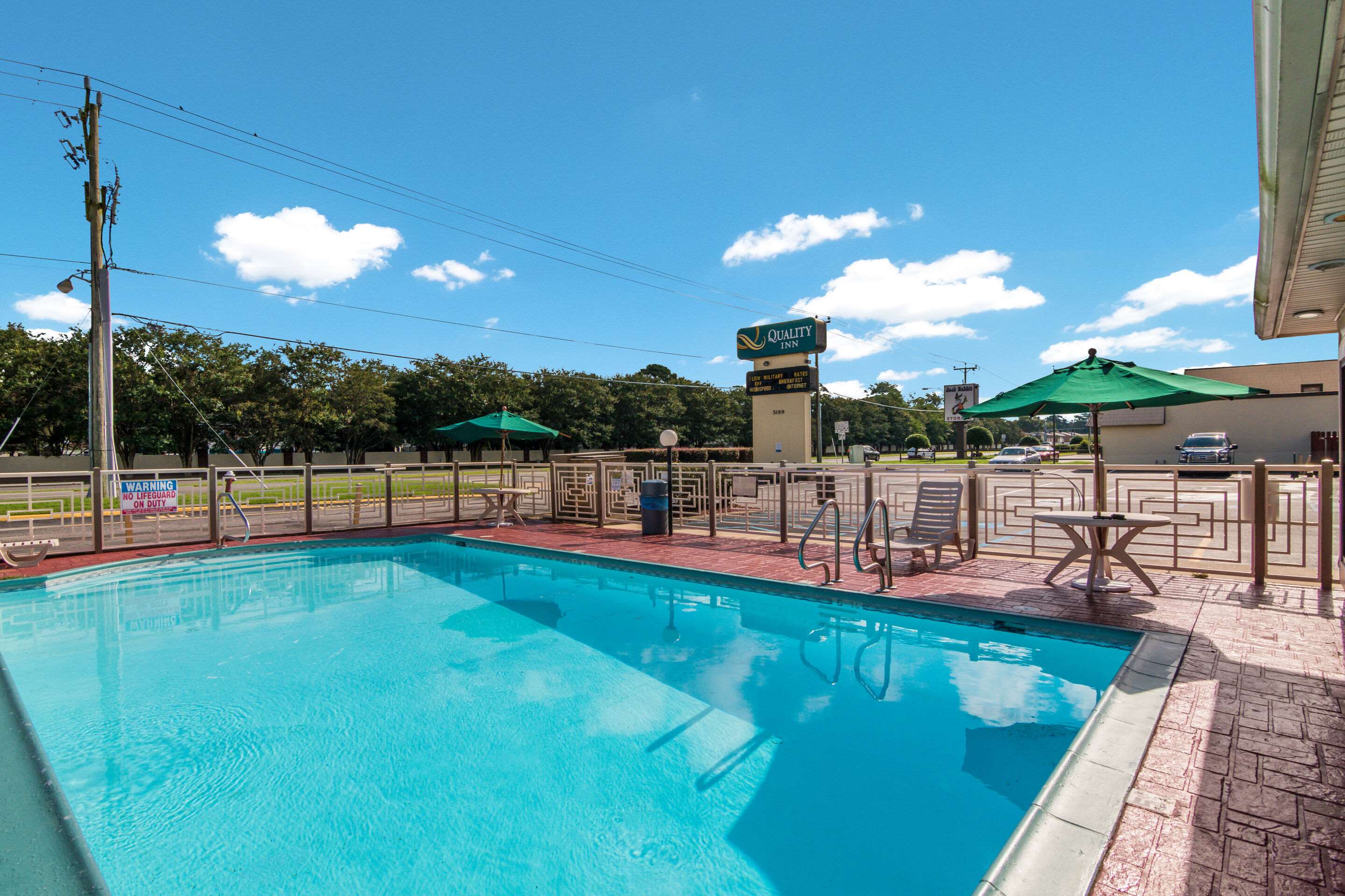 Relax by the pool | Quality Inn Little Creek