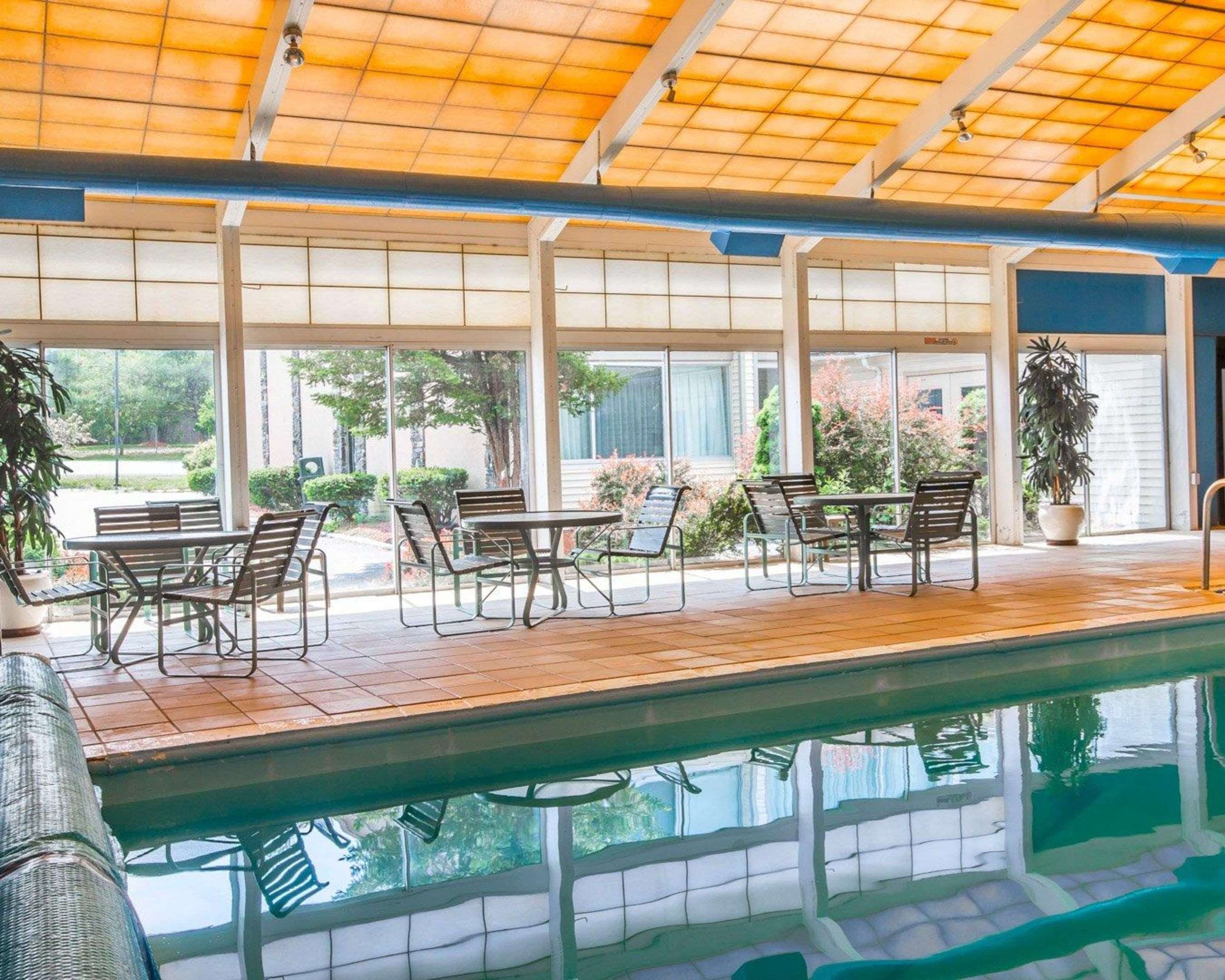 Indoor pool with sitting area | Quality Inn & Conference Center