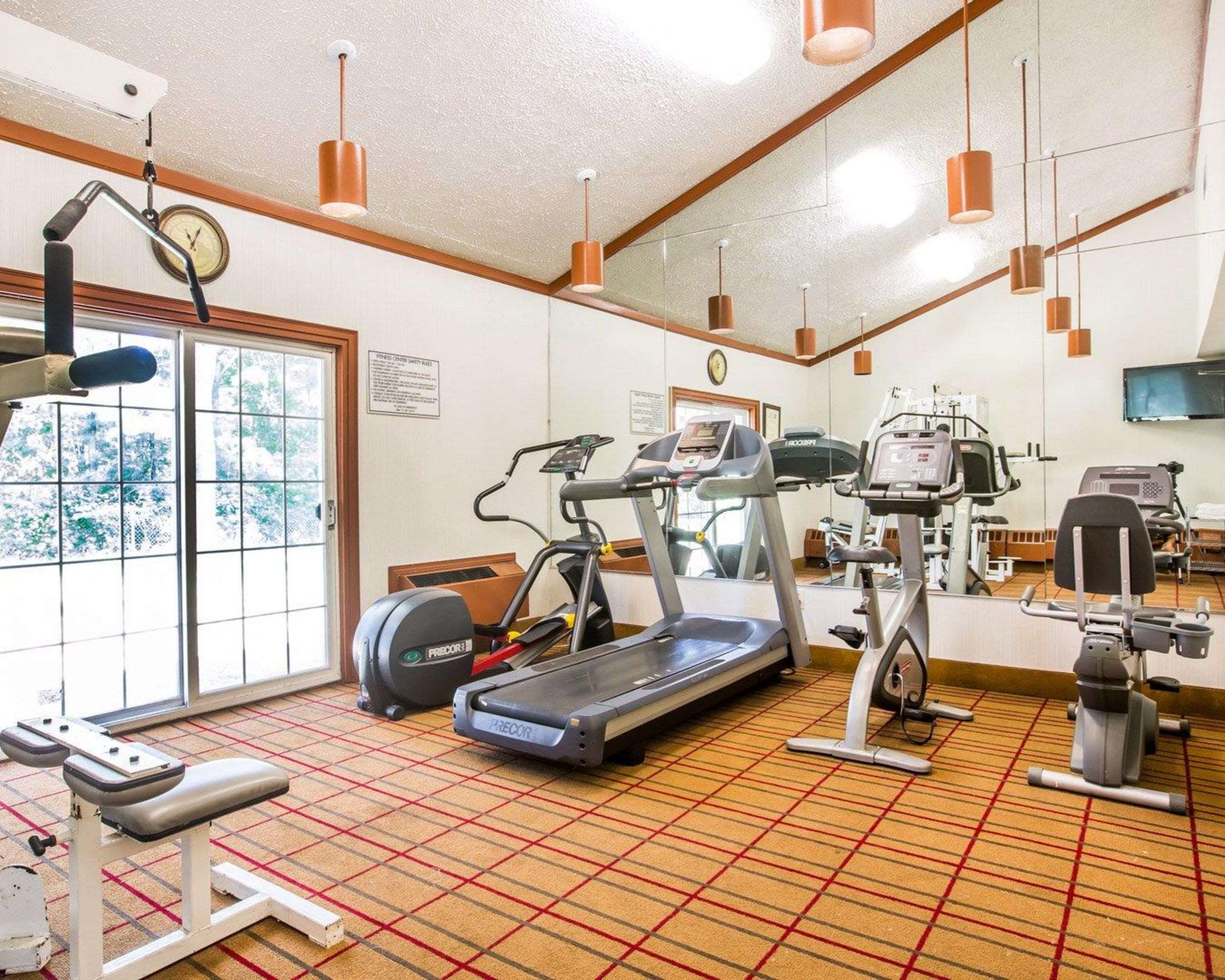 Fitness center with cardio equipment and weights | Quality Inn & Conference Center