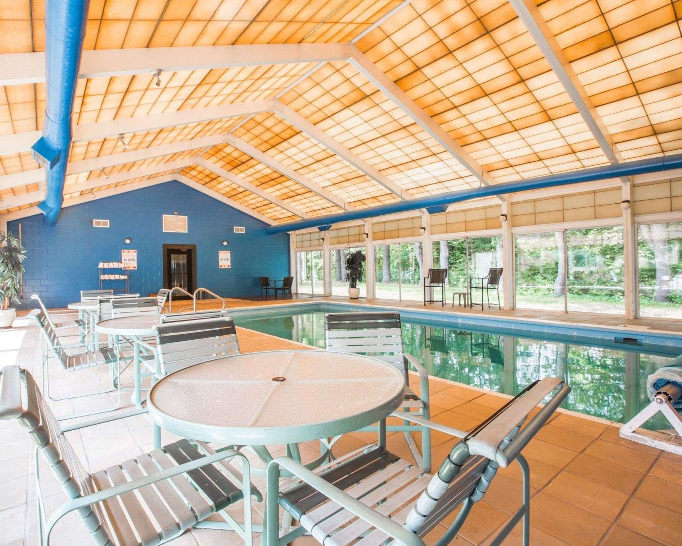 Pool lounge area | Quality Inn & Conference Center