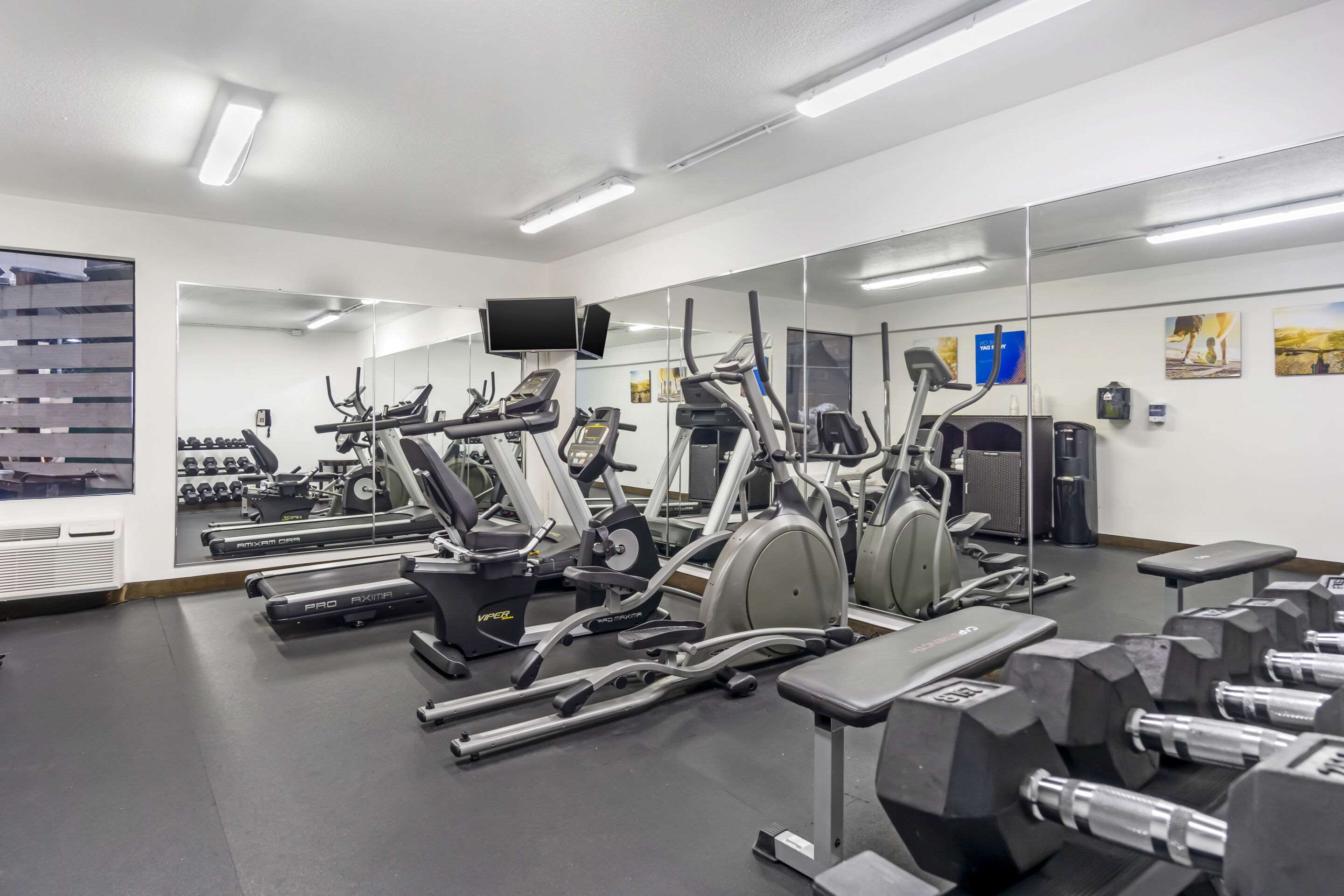Exercise room with cardio equipment | Comfort Inn & Suites SeaTac