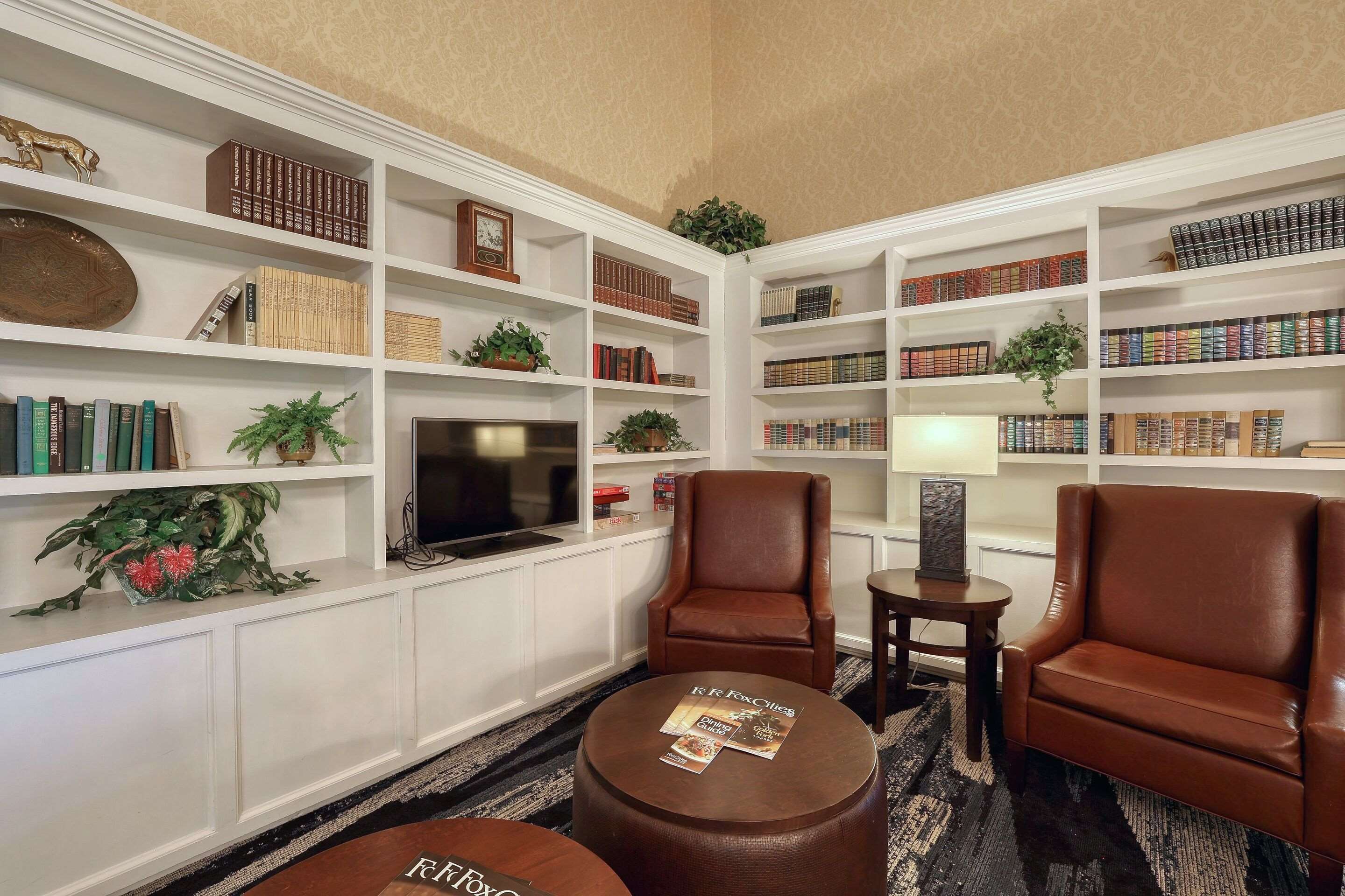 Spacious lobby with sitting area | Comfort Suites Appleton Airport