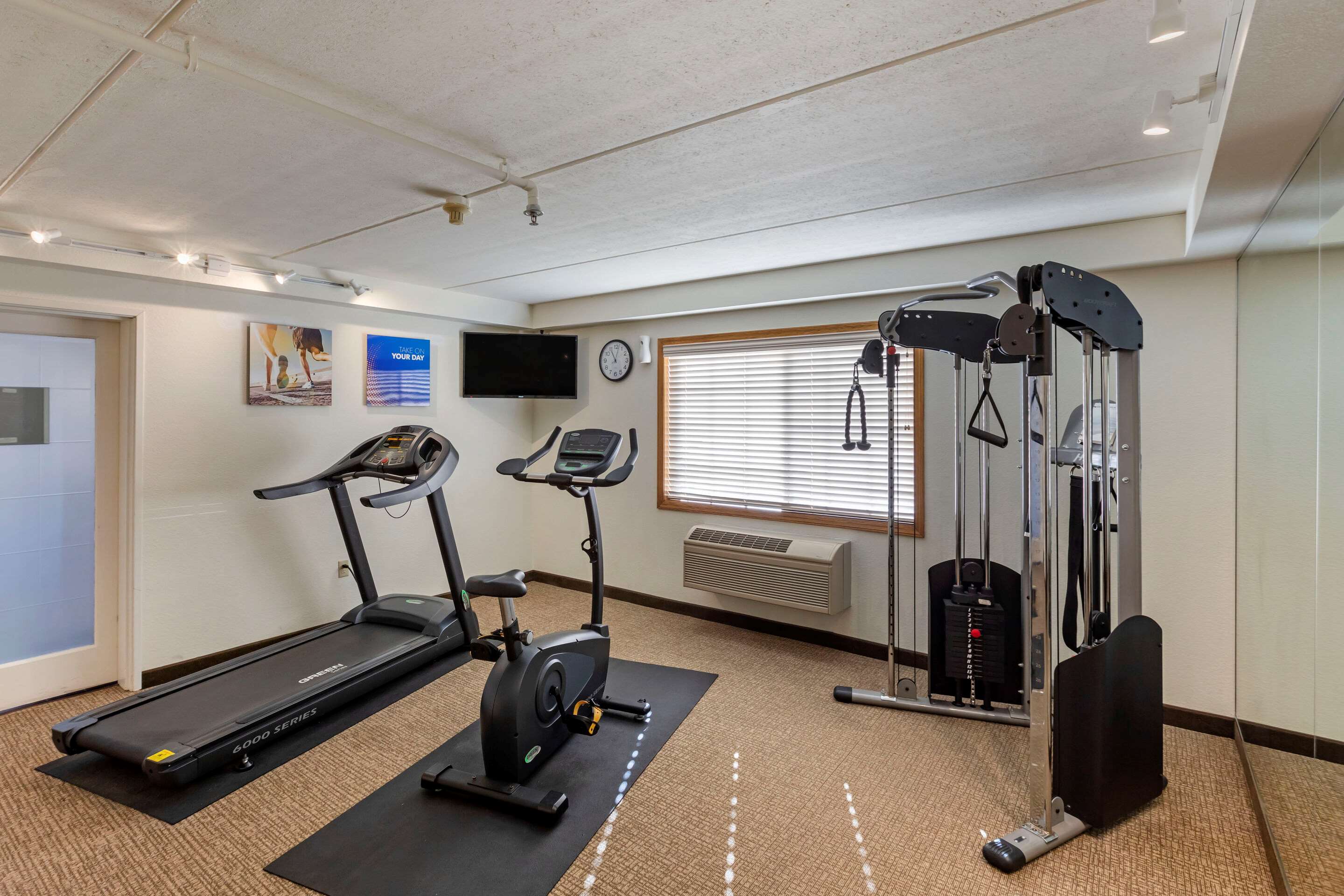 Exercise room with cardio equipment | Comfort Inn & Suites Jackson - West Bend
