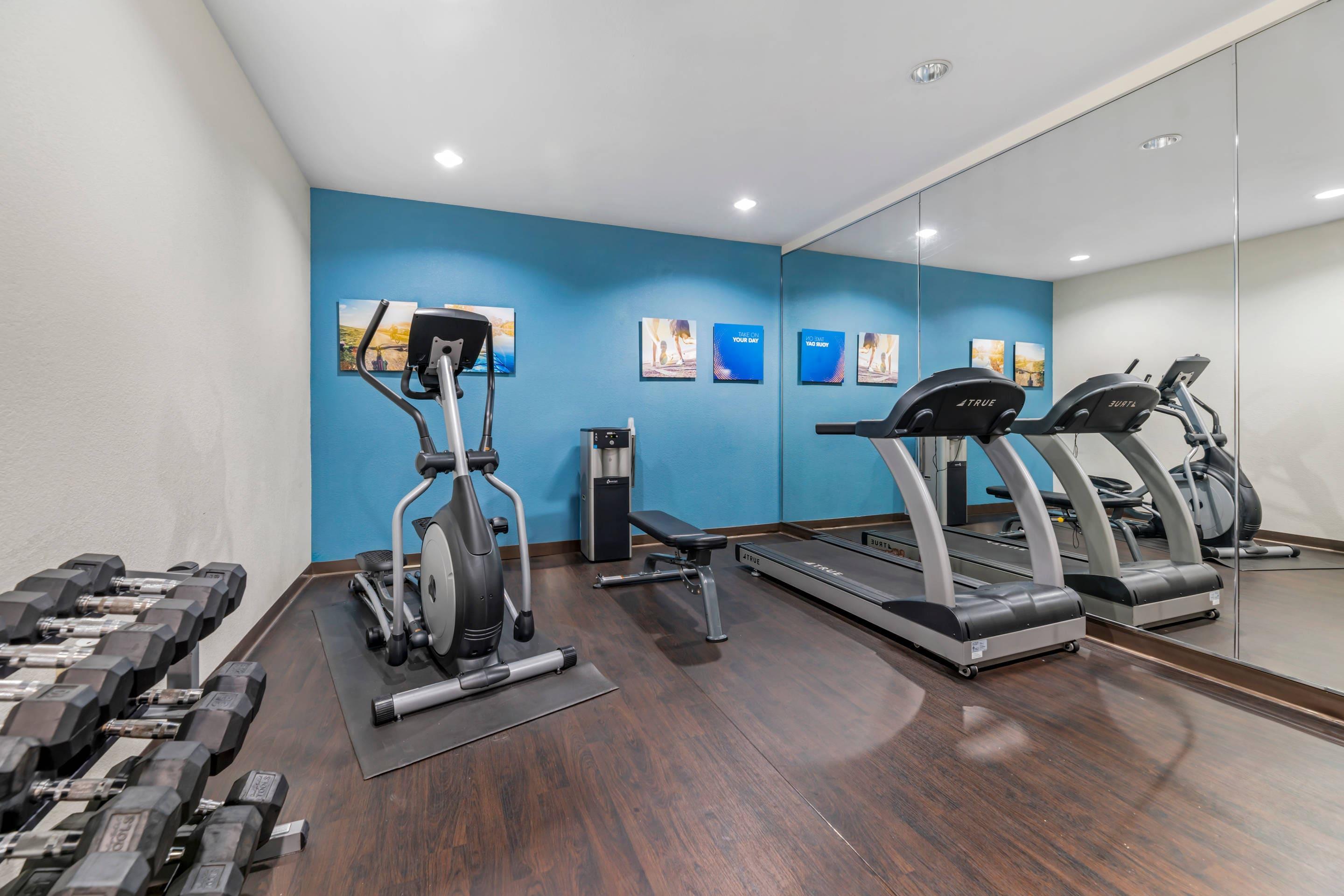 Exercise room with cardio equipment and weights | Comfort Suites Lake Geneva East