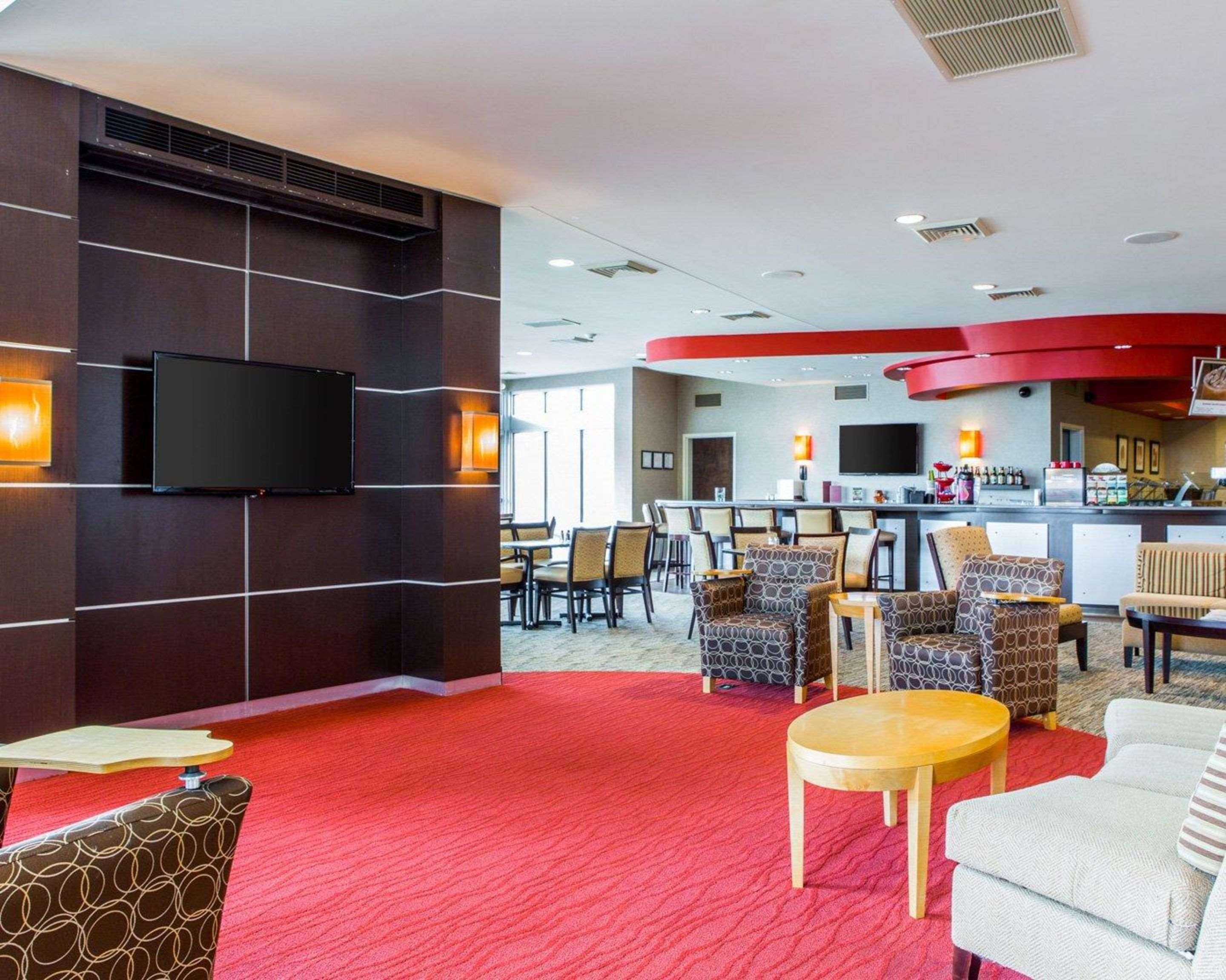 Catch up on the day in front of the large-screen media wall | Cambria Hotel Appleton