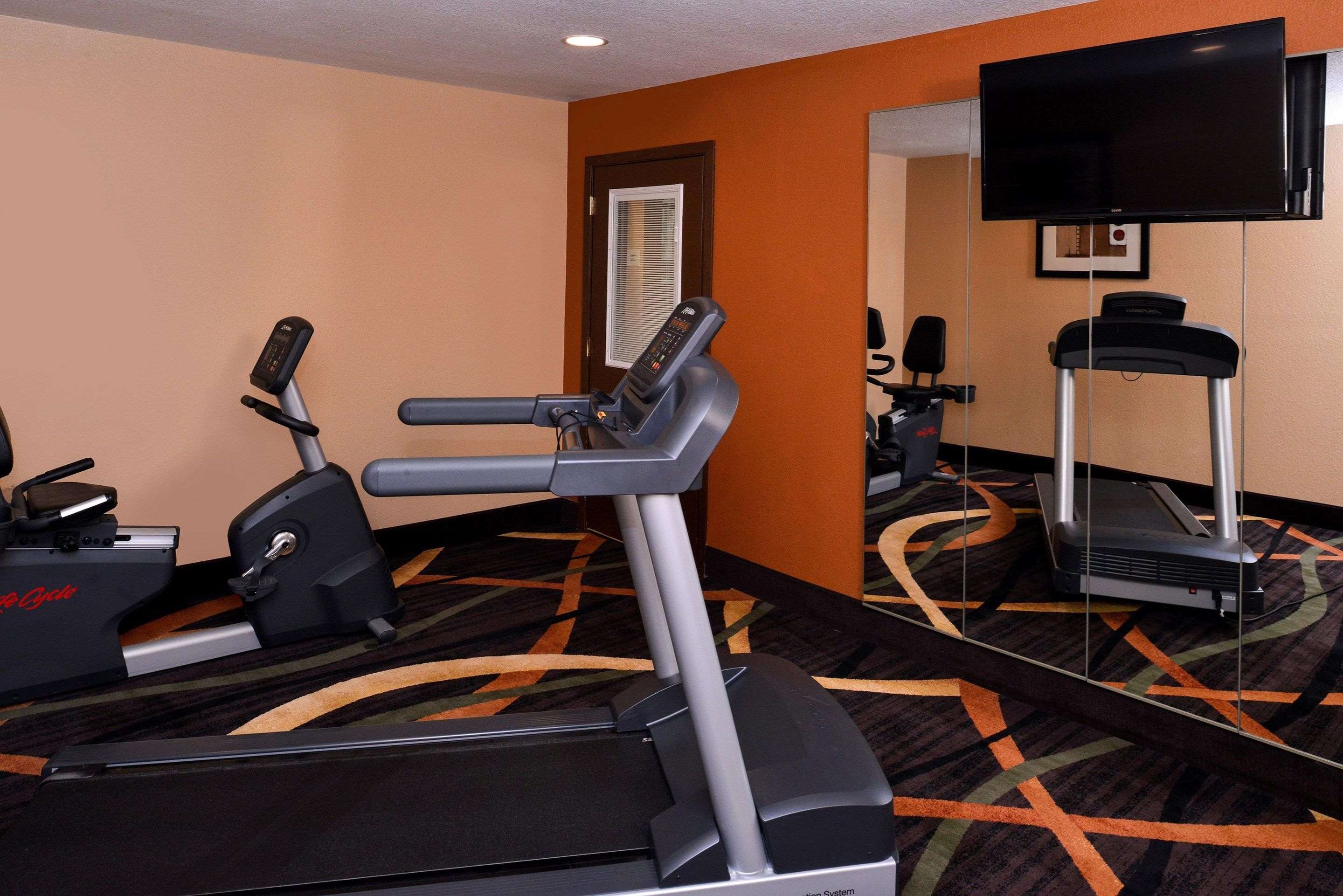 Fitness center with television | Quality Inn