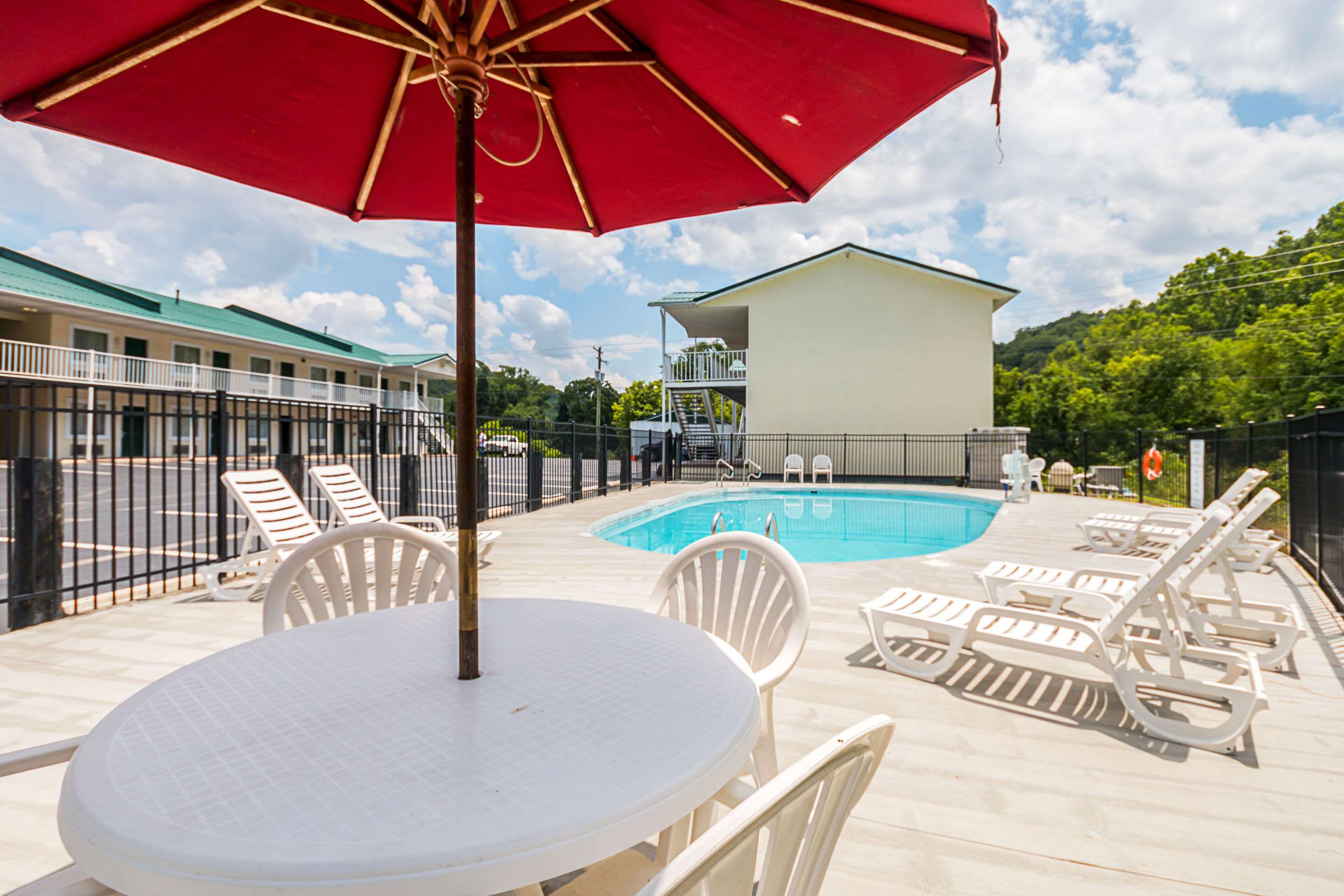 Relax by the pool | Quality Inn