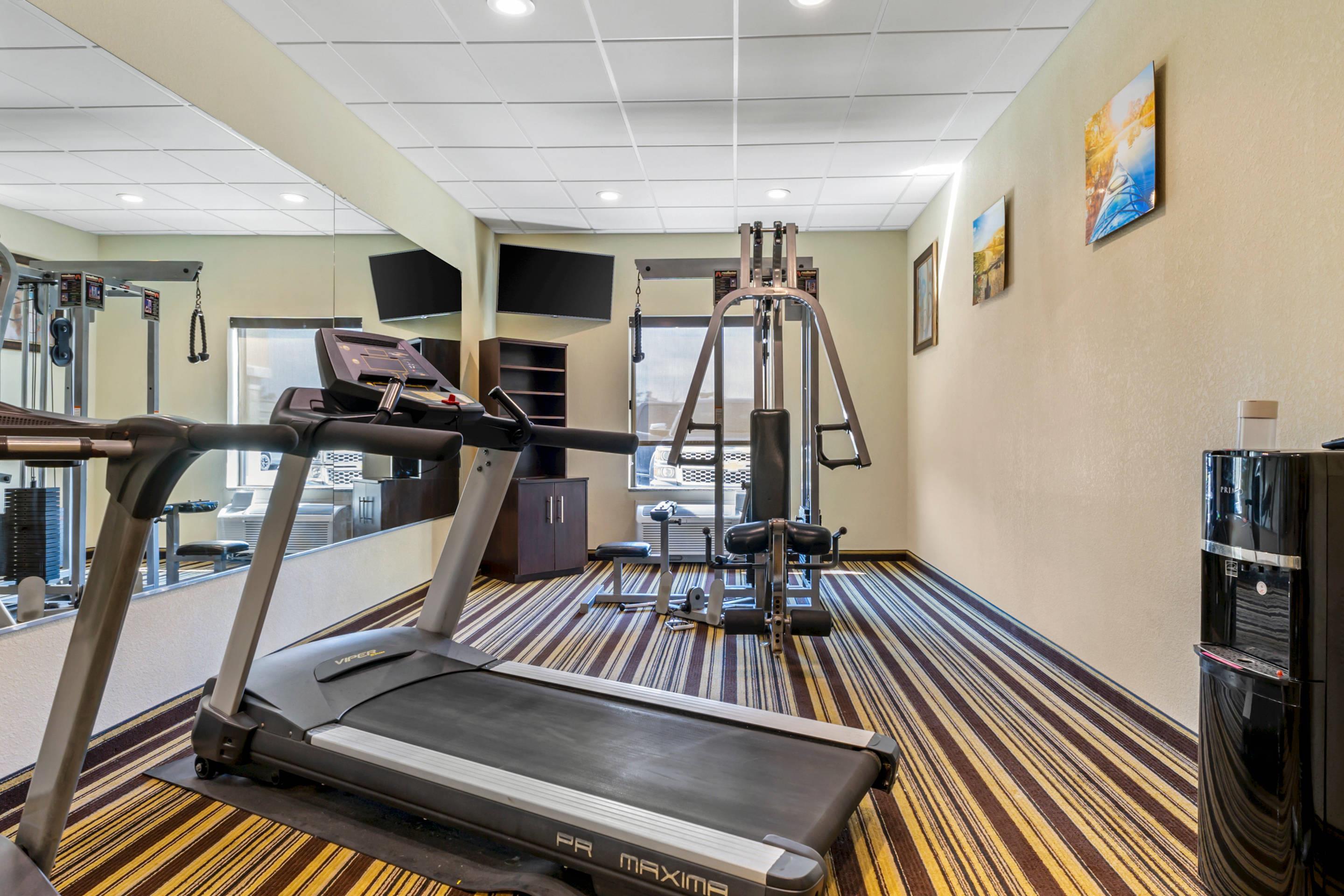 Exercise room with cardio equipment and weights | Comfort Inn & Suites