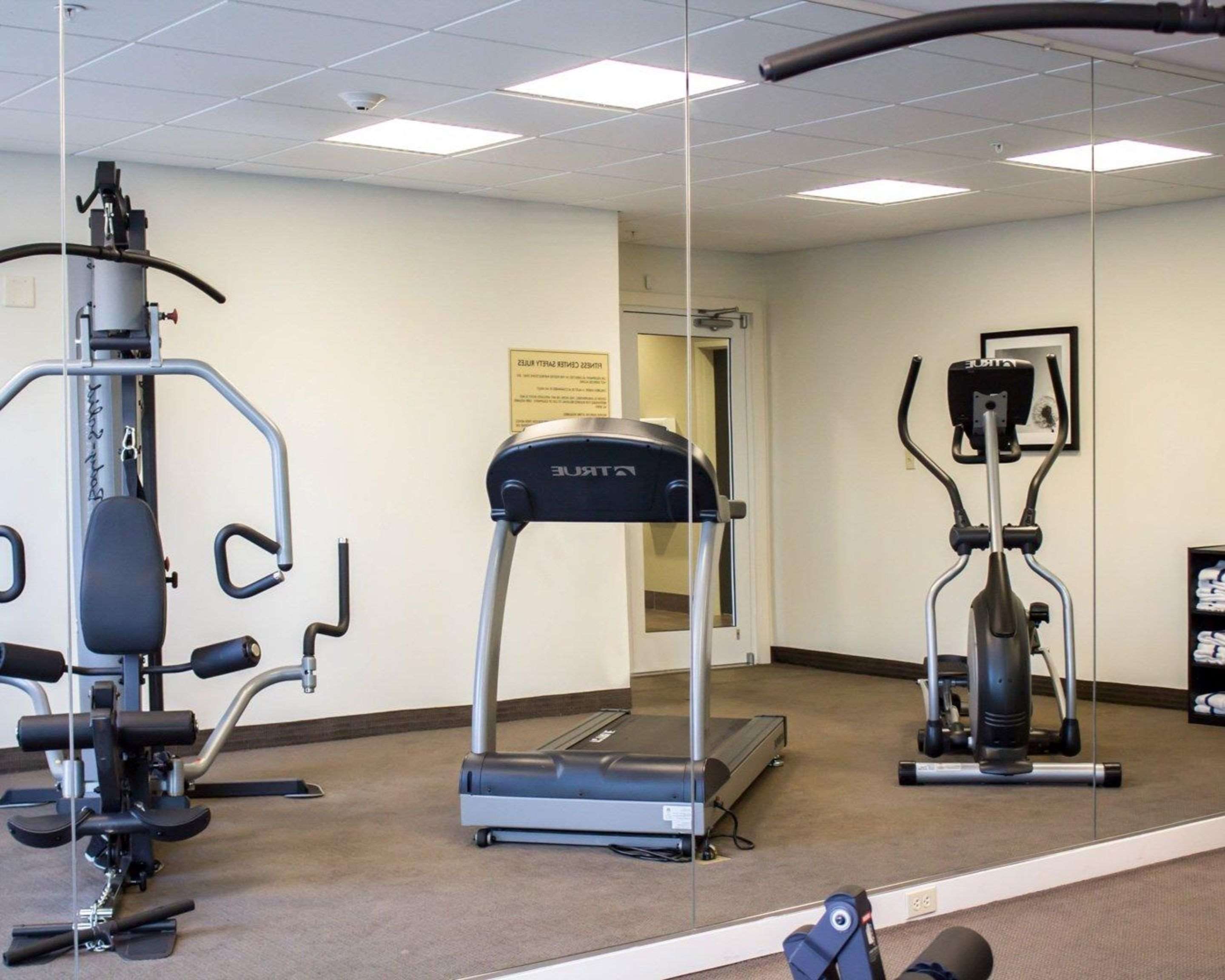 Exercise room with cardio equipment and weights