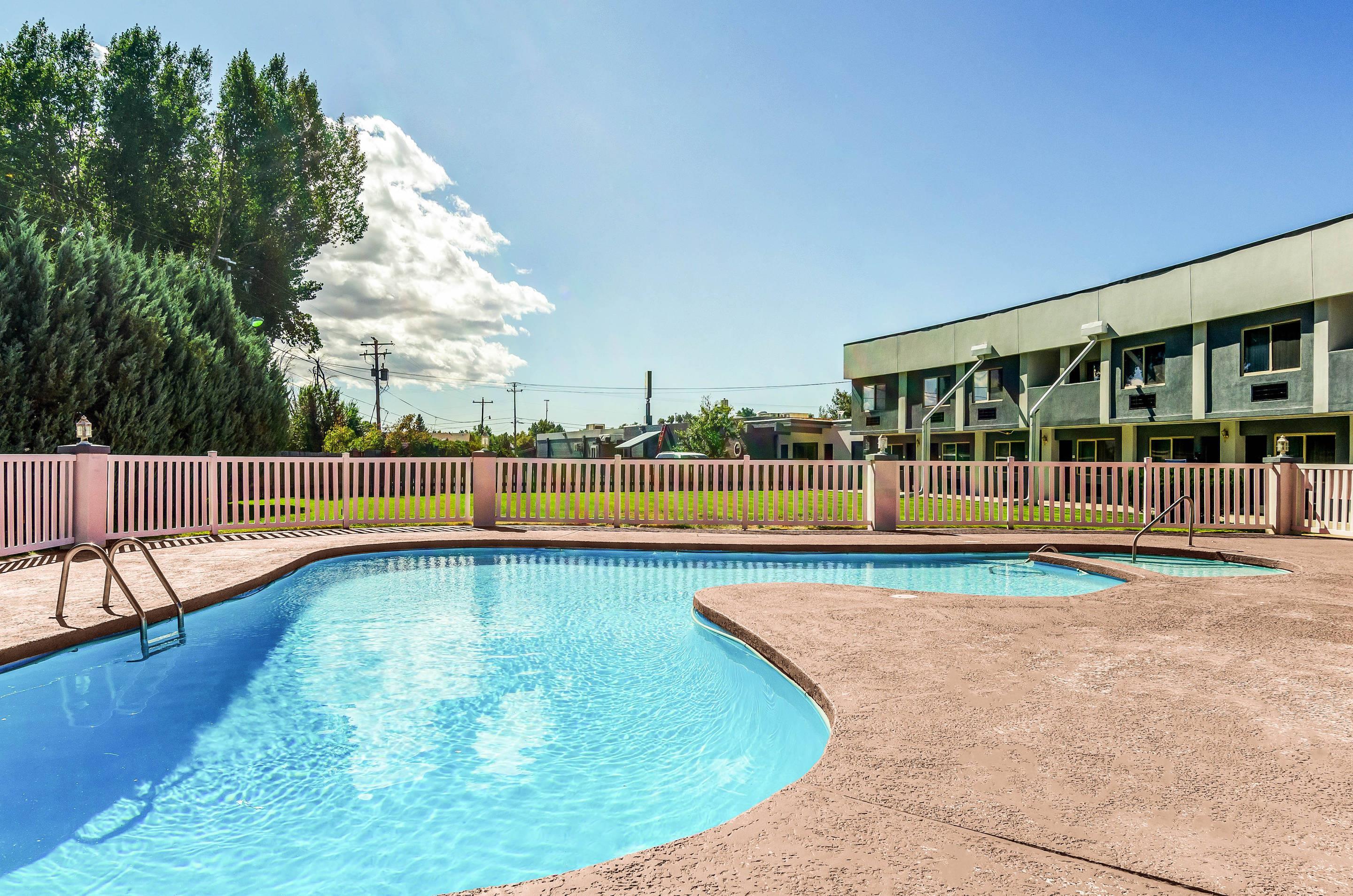 Relax by the pool | Quality Inn