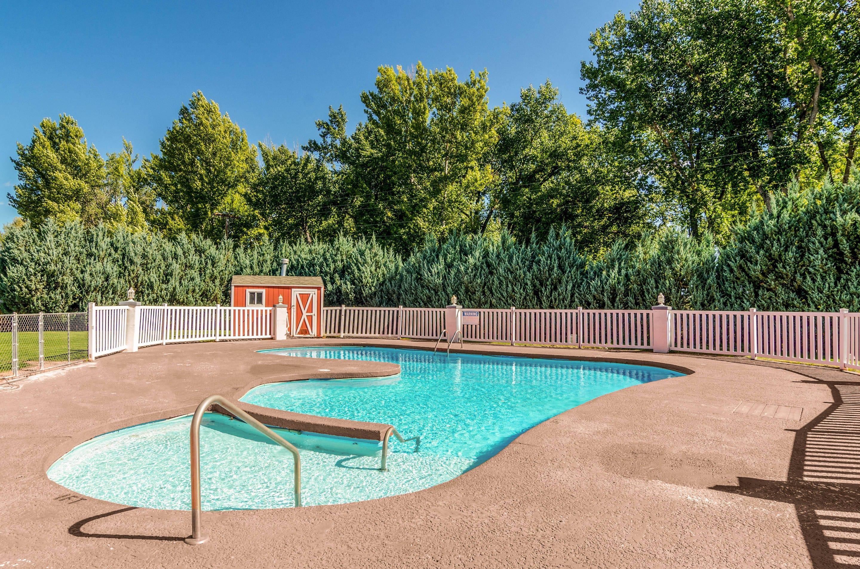 Relax by the pool | Quality Inn