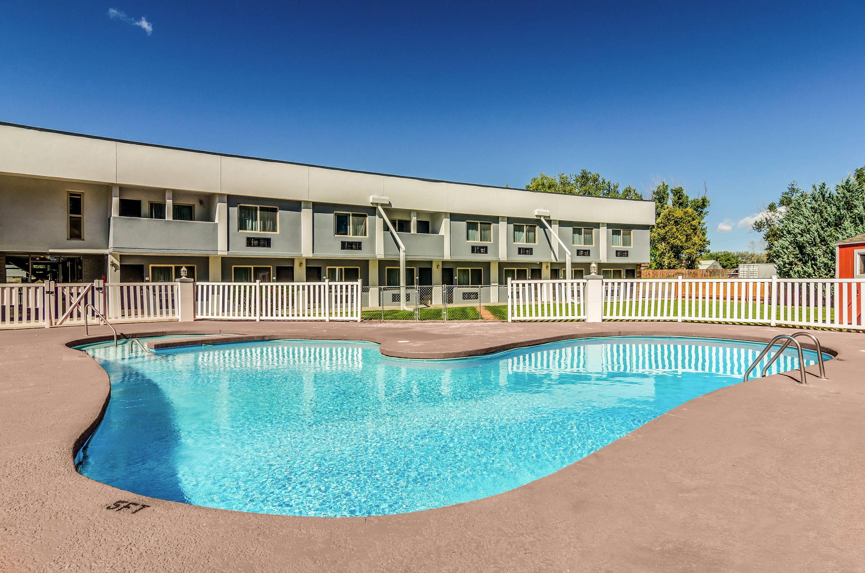 Relax by the pool | Quality Inn
