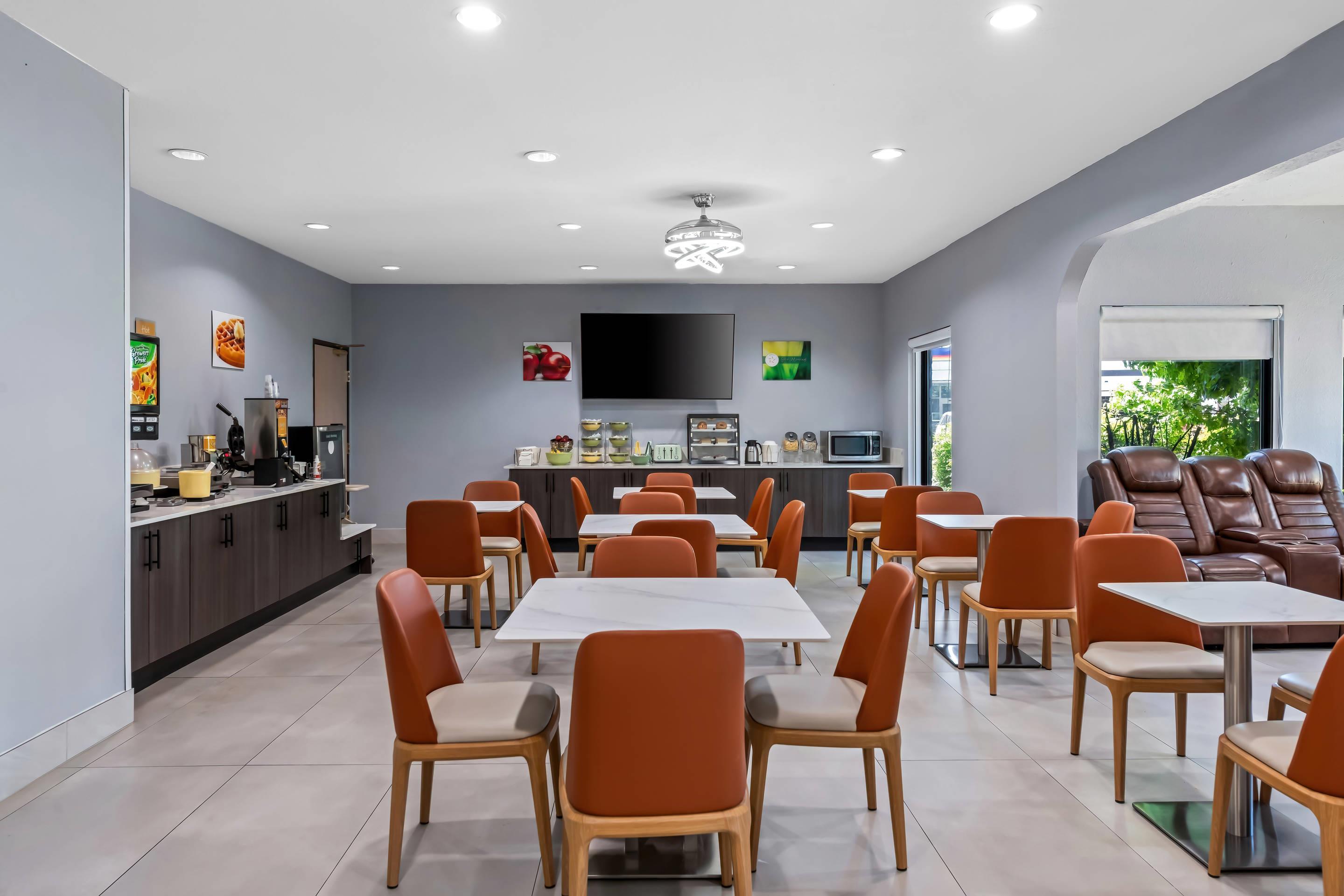 Enjoy breakfast in this seating area | Quality Inn & Suites