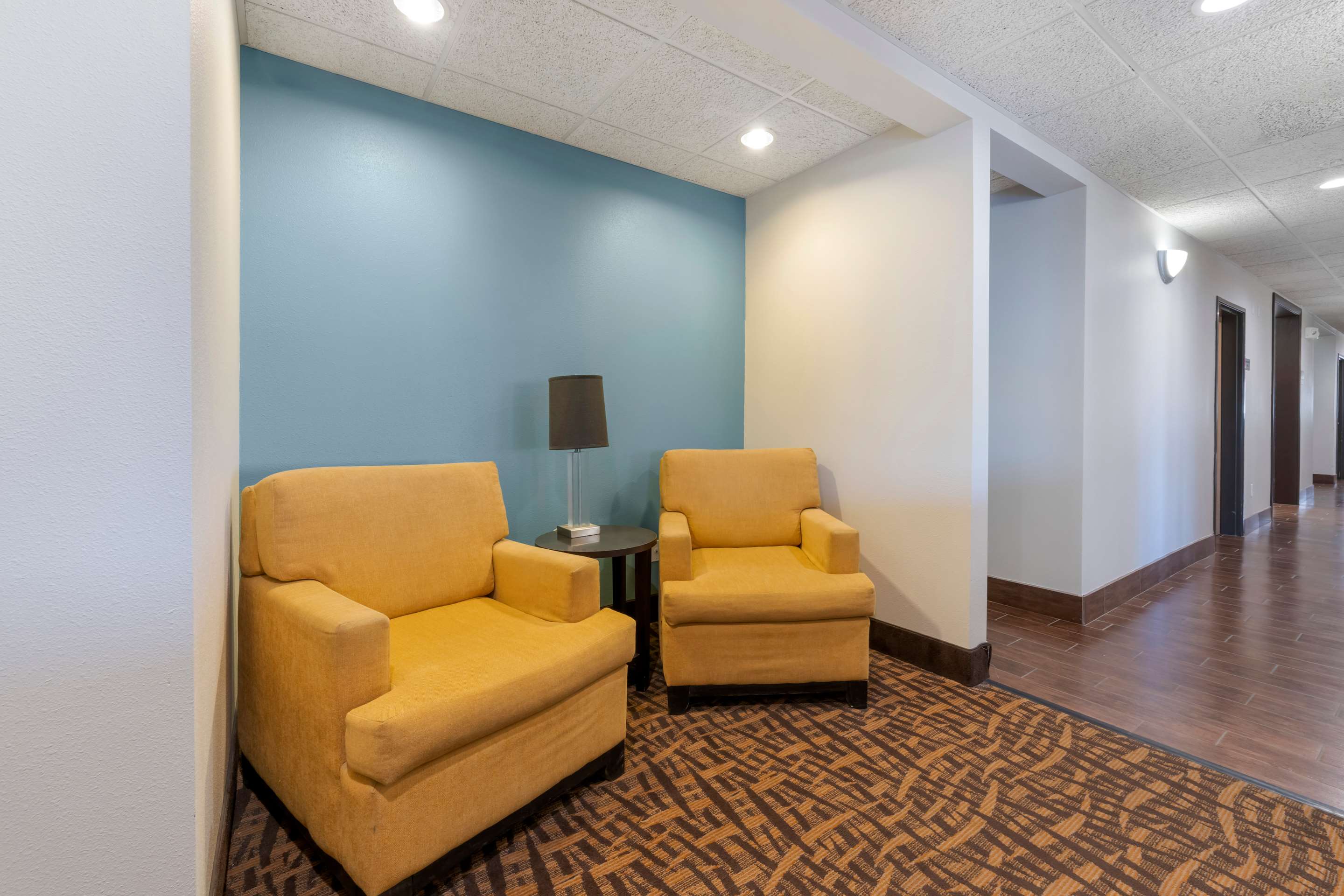 Spacious lobby with sitting area | Sleep Inn & Suites Hays I-70