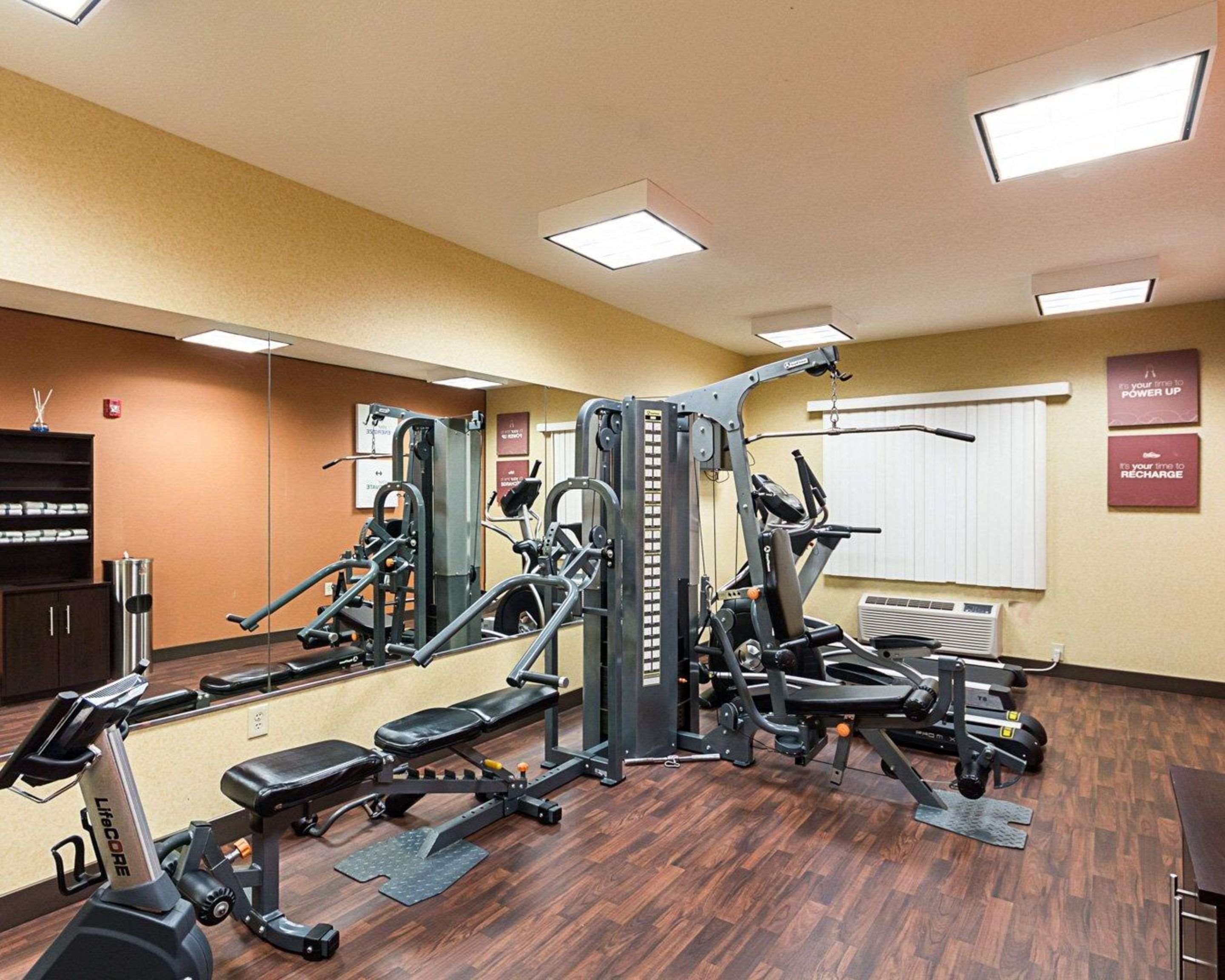 Exercise room with cardio equipment and weights