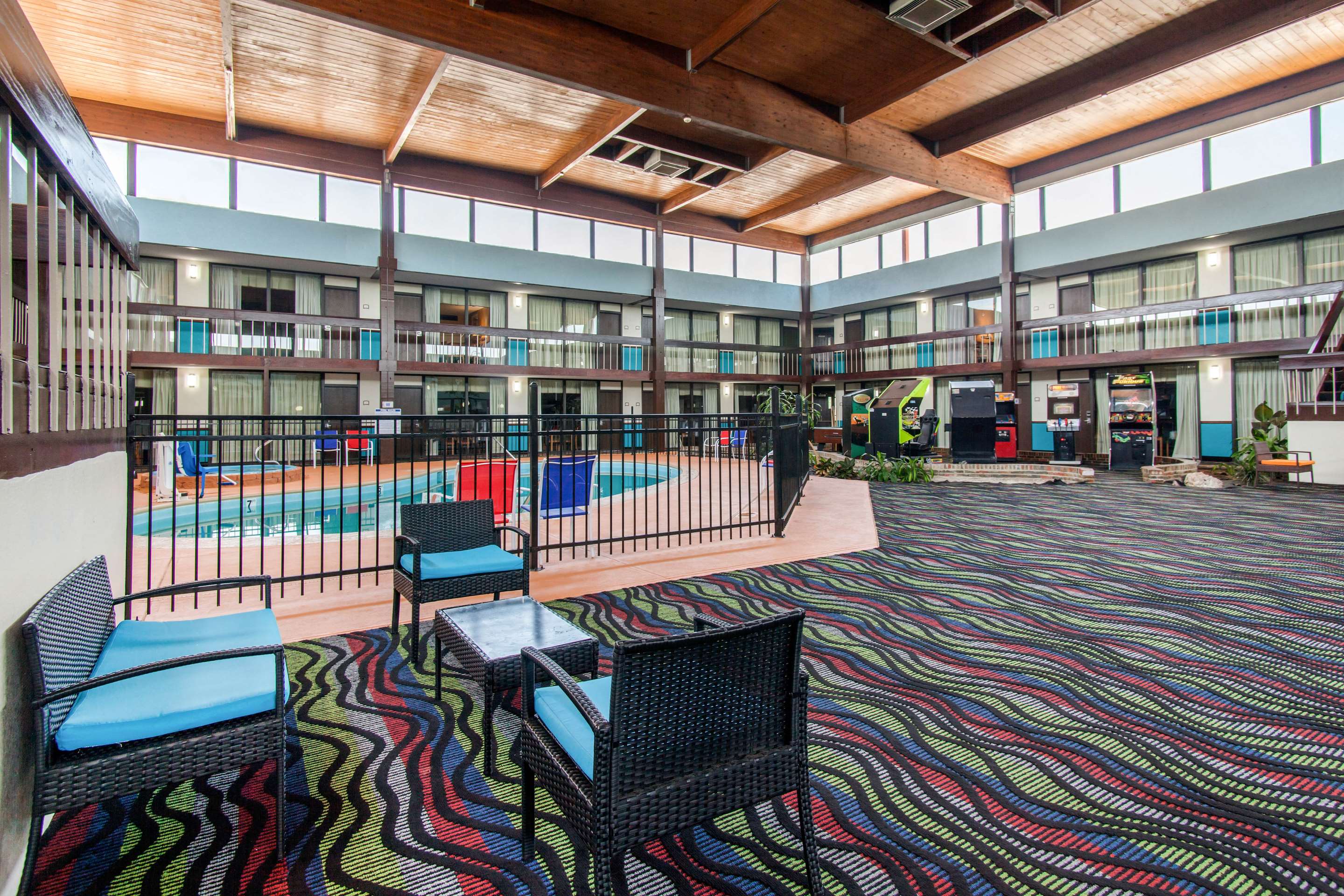Relax by the pool | Quality Inn