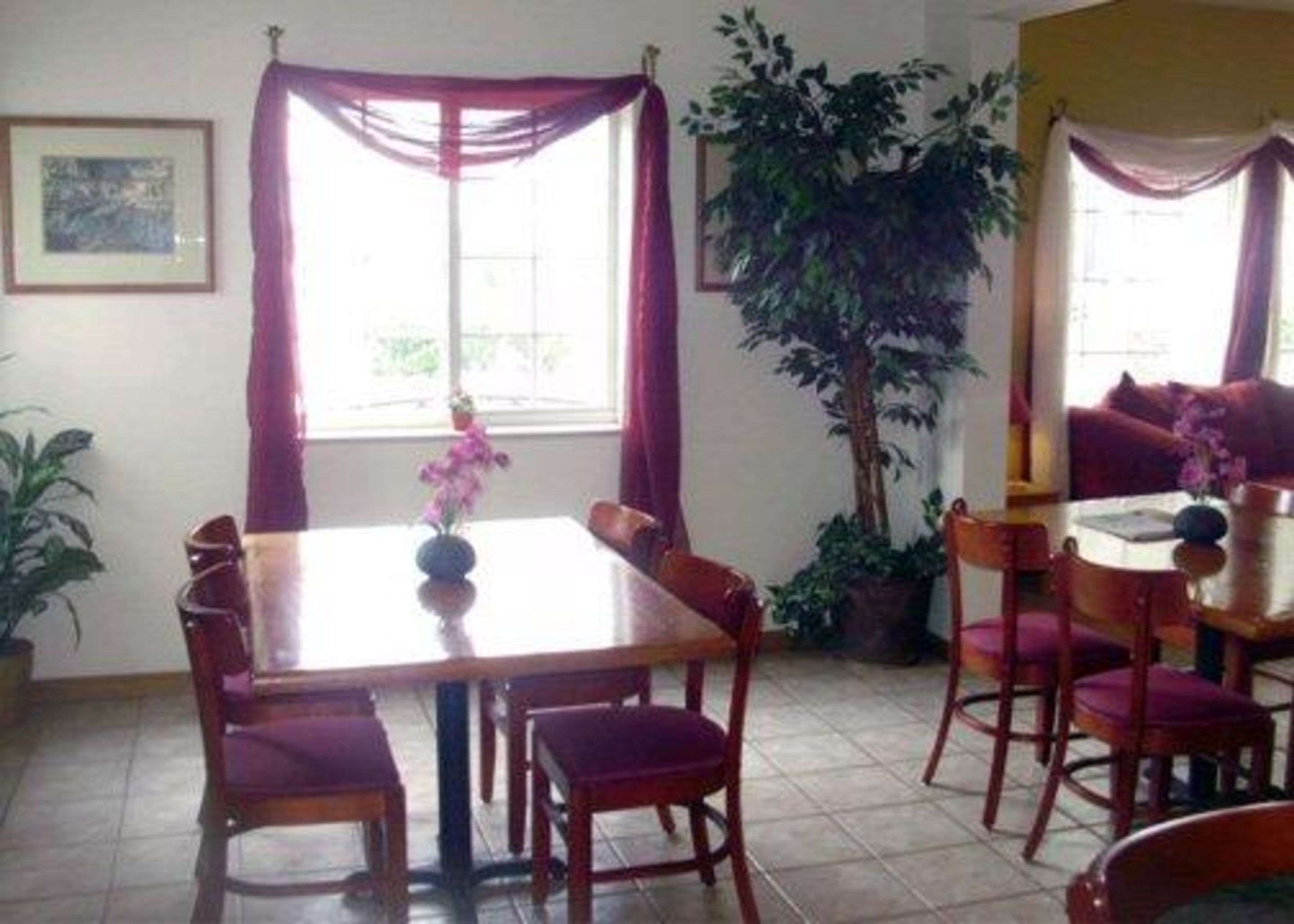 Enjoy breakfast in this seating area | Rodeway Inn Salina
