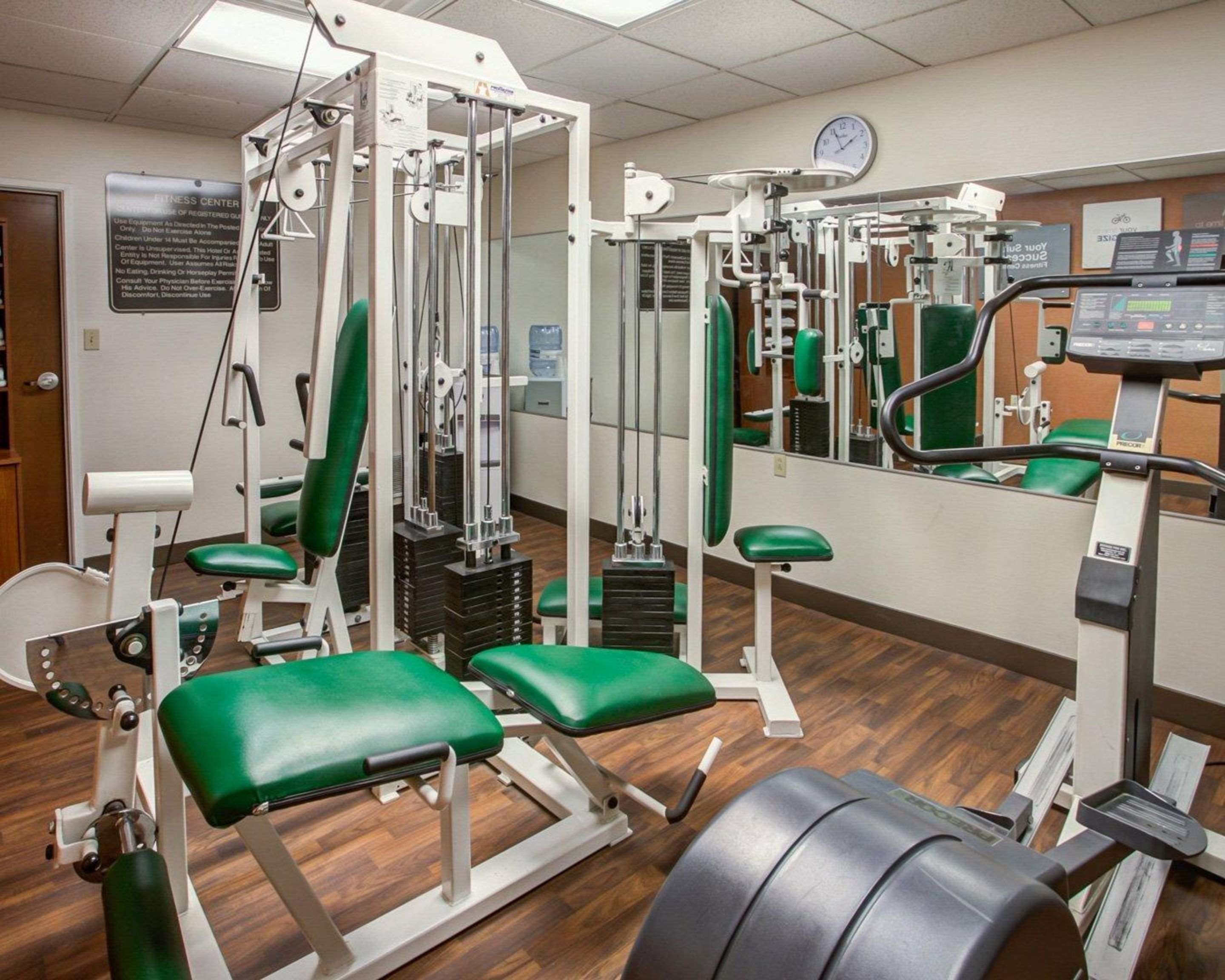 Fitness center with cardio equipment and weights | Comfort Suites