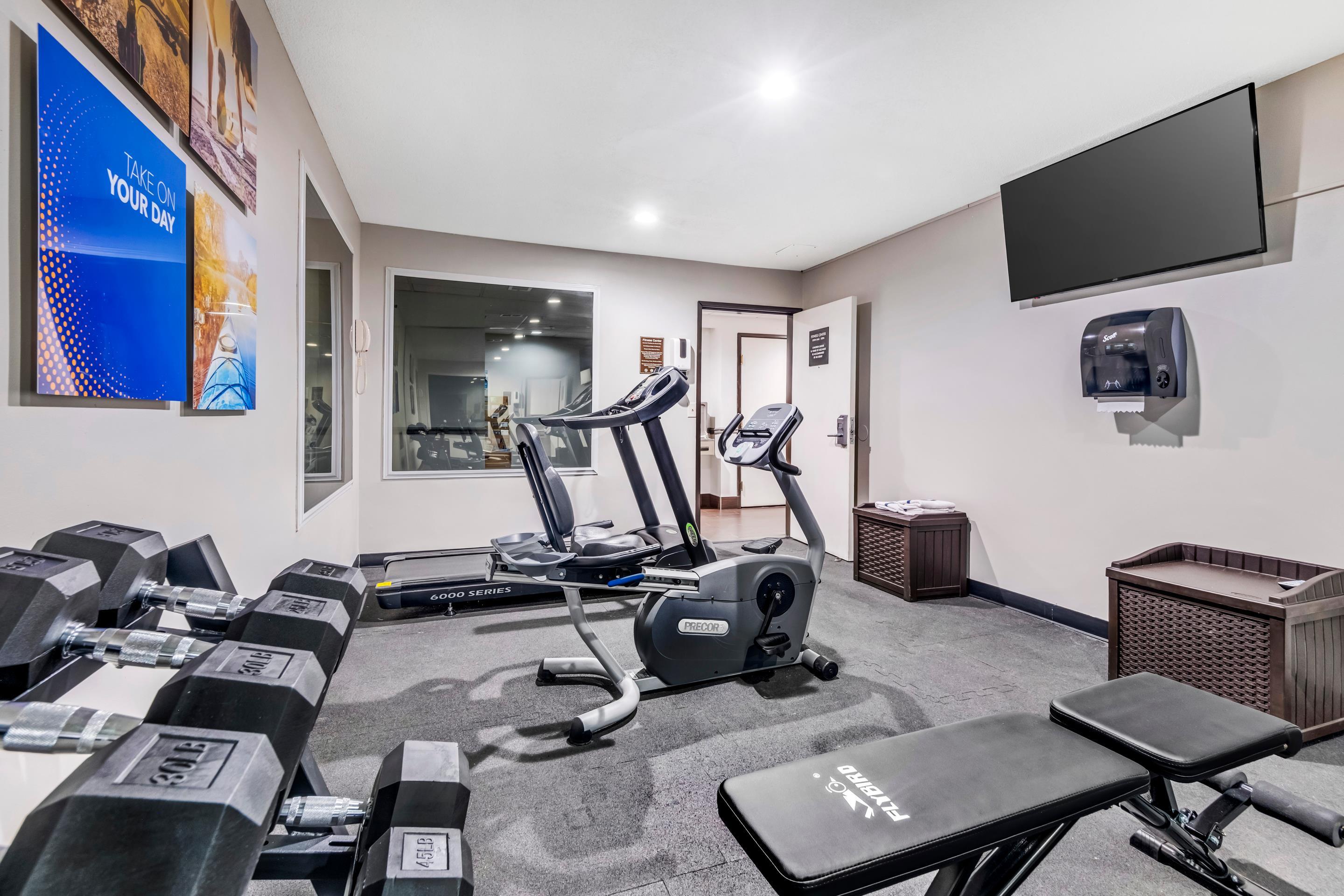 Exercise room with cardio equipment and weights | Comfort Inn Somerset KY