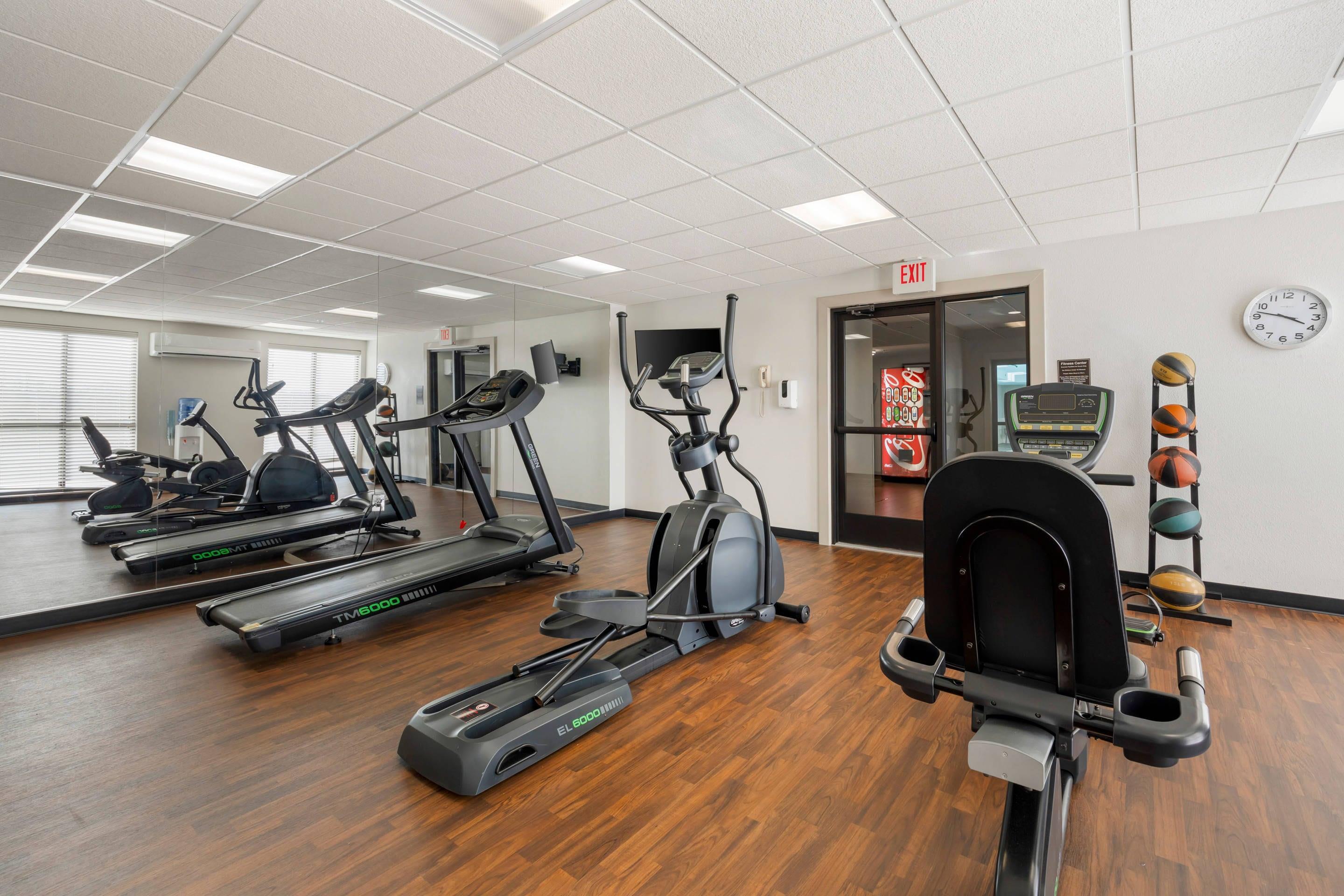 Exercise room with cardio equipment and weights