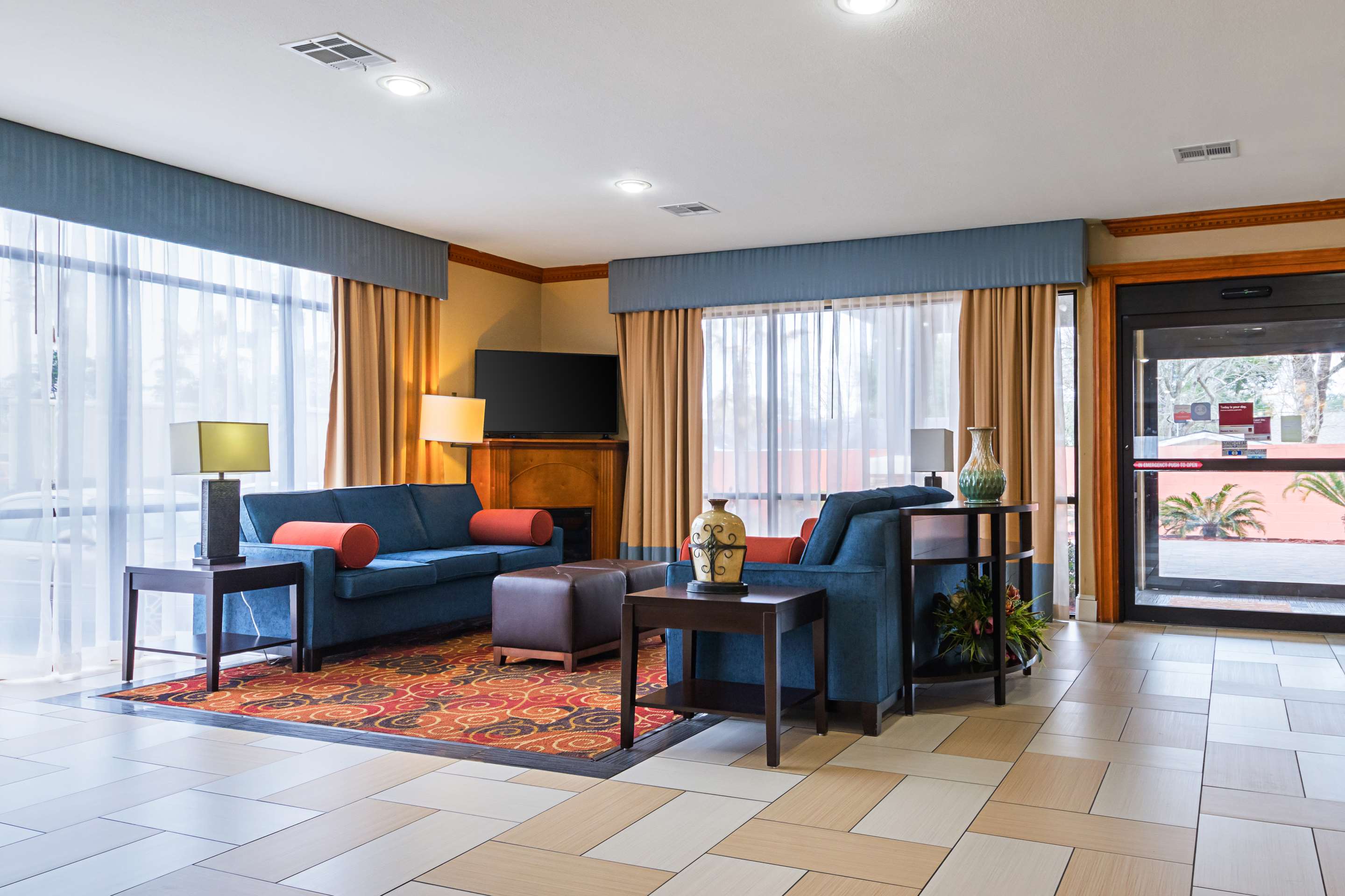 Spacious lobby with sitting area | Comfort Suites Lake Charles