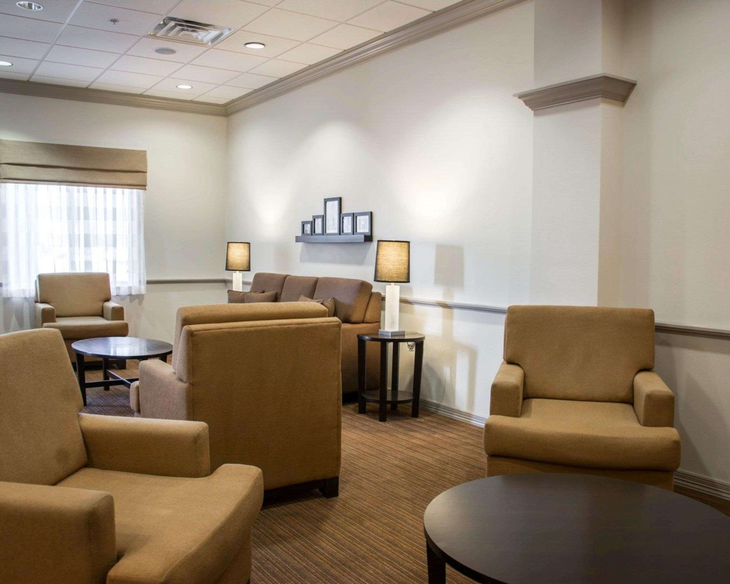 Relax in the open space lobby with club-lounge seating | Sleep Inn & Suites Medical Center