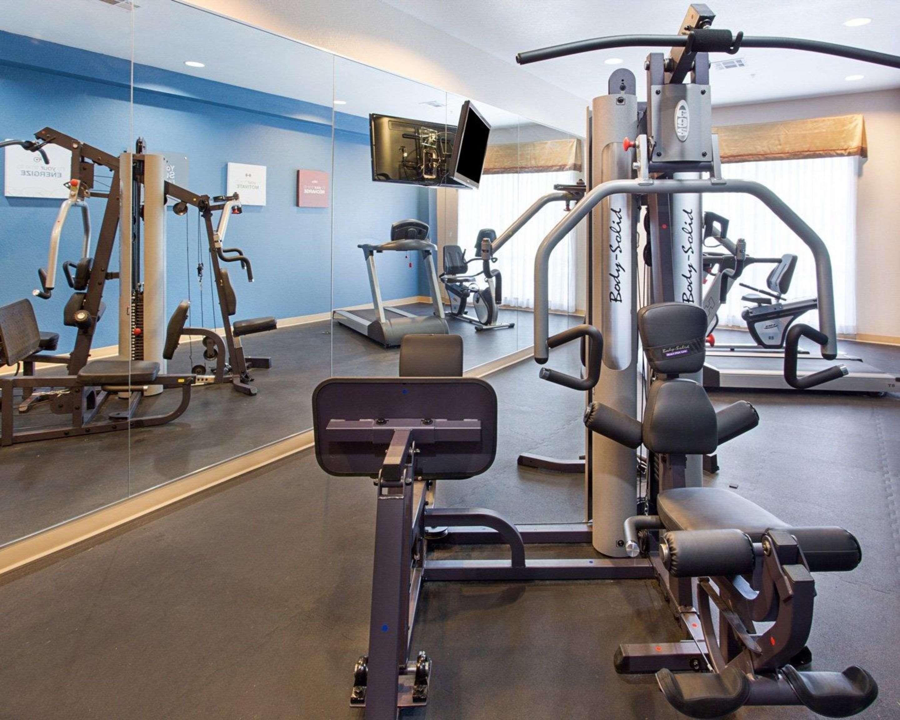 Fitness center with cardio equipment and weights