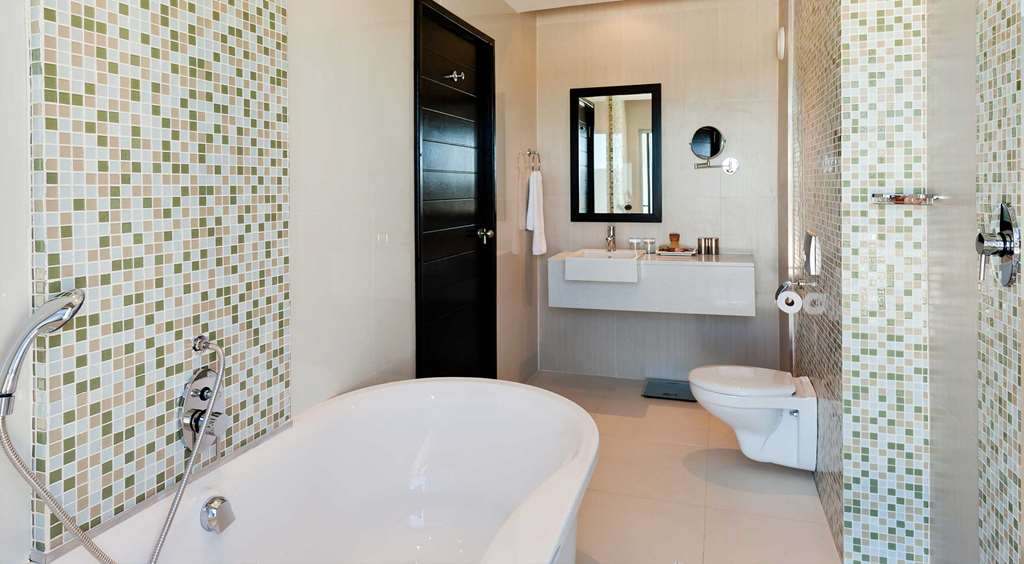 The Oasis-guestroom-Guest Room,Bathroom,Suite,On-Site.jpg