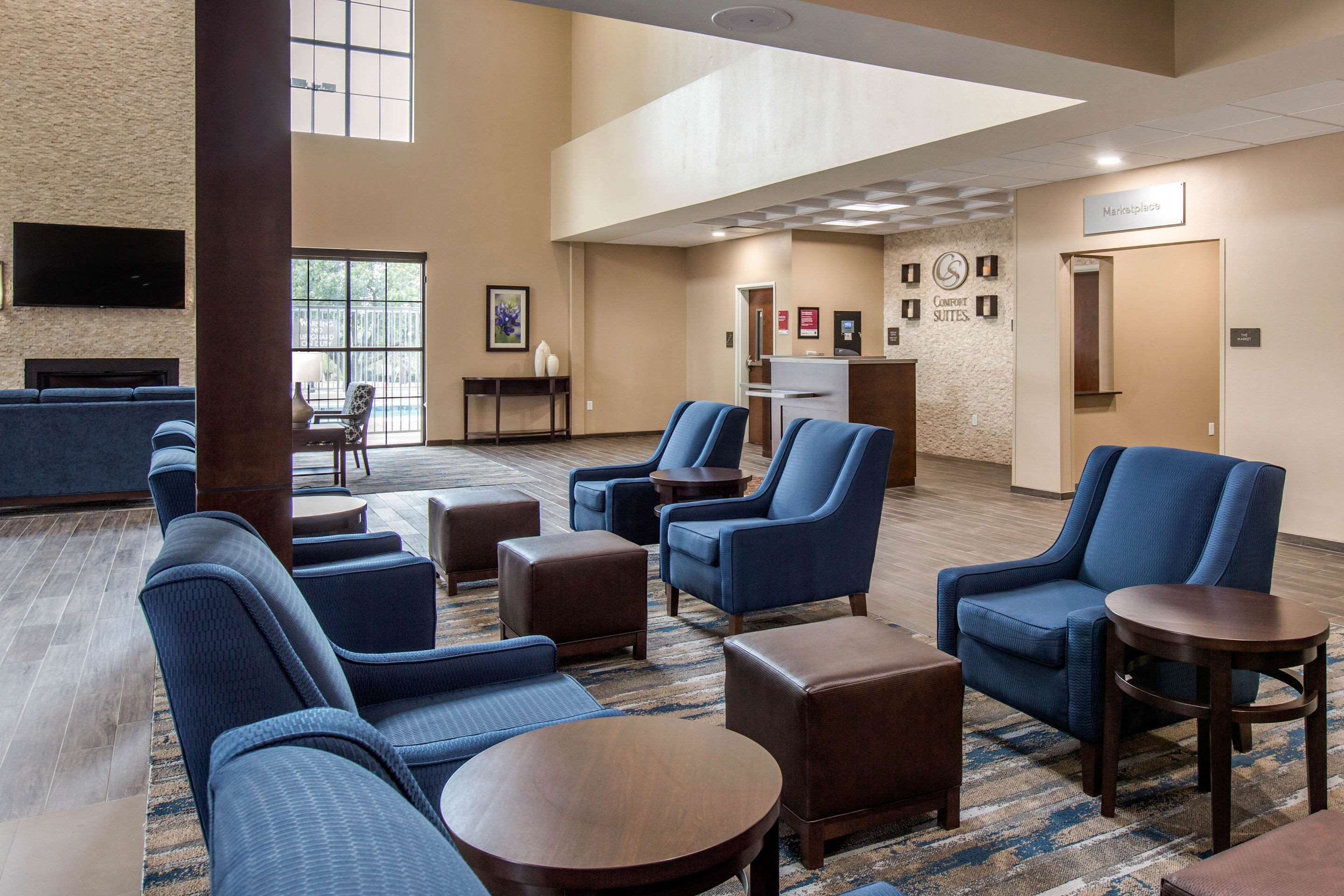 Spacious lobby with sitting area | Comfort Suites - South Austin