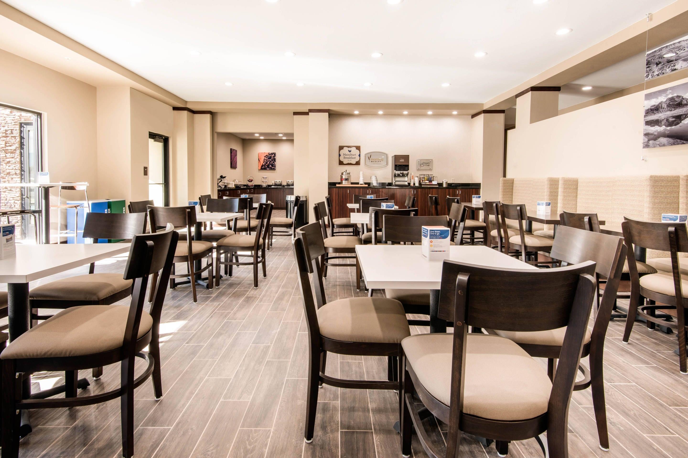 Enjoy breakfast in this seating area | MainStay Suites Moab near Arches National Park