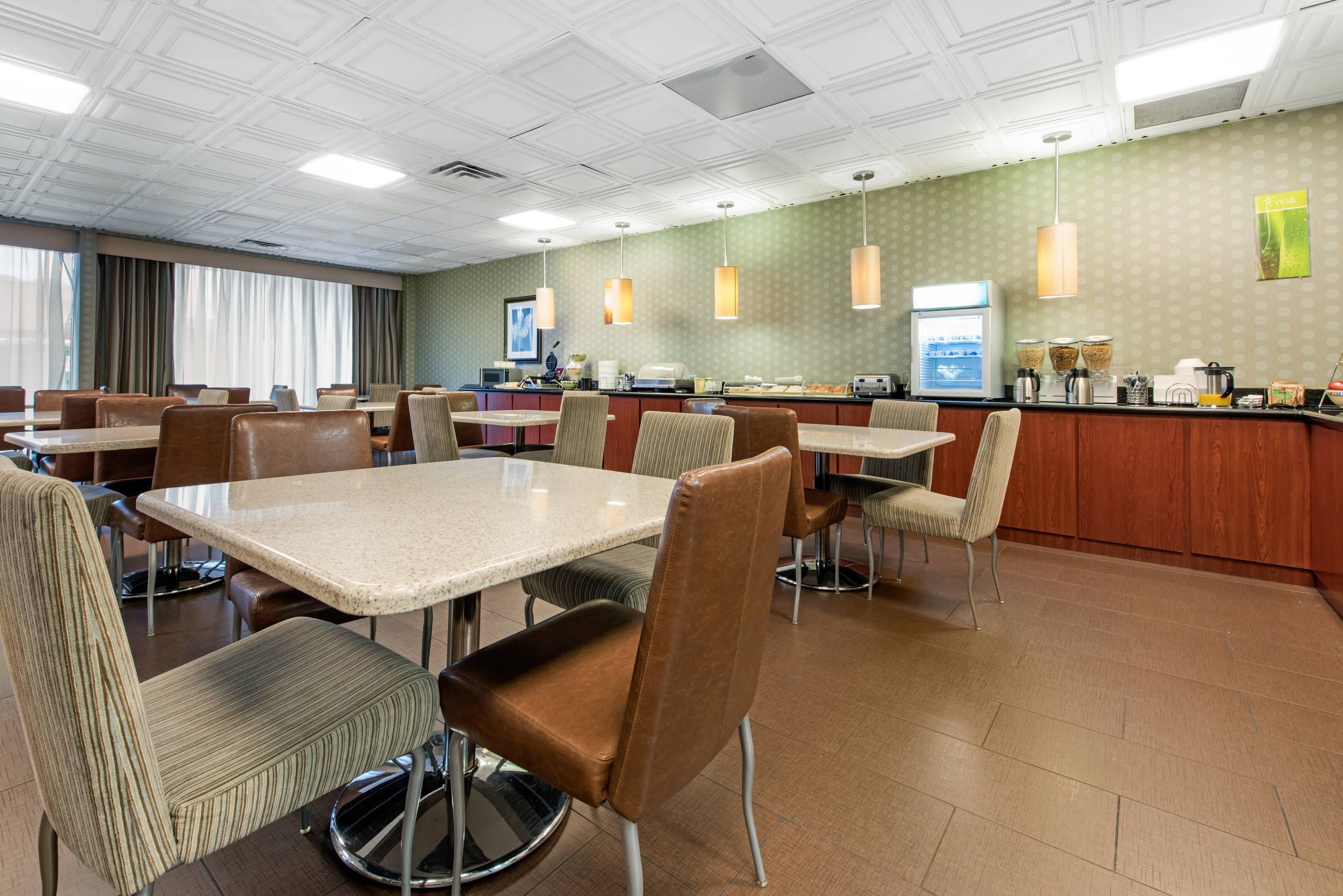 Enjoy breakfast in this seating area | Quality Inn & Suites