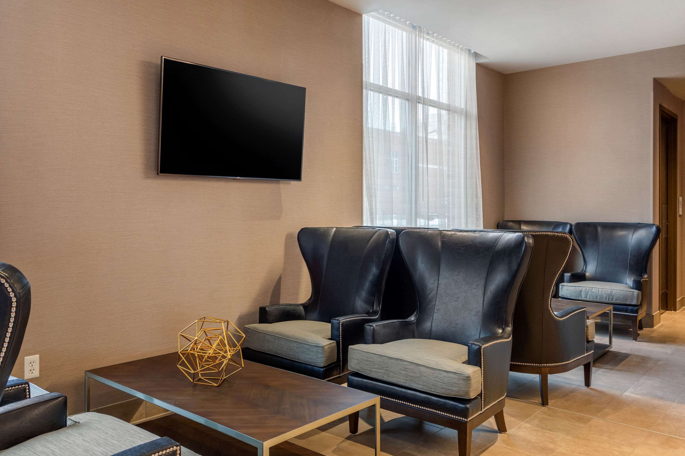 Lobby with sitting area | Cambria Hotel Omaha Downtown