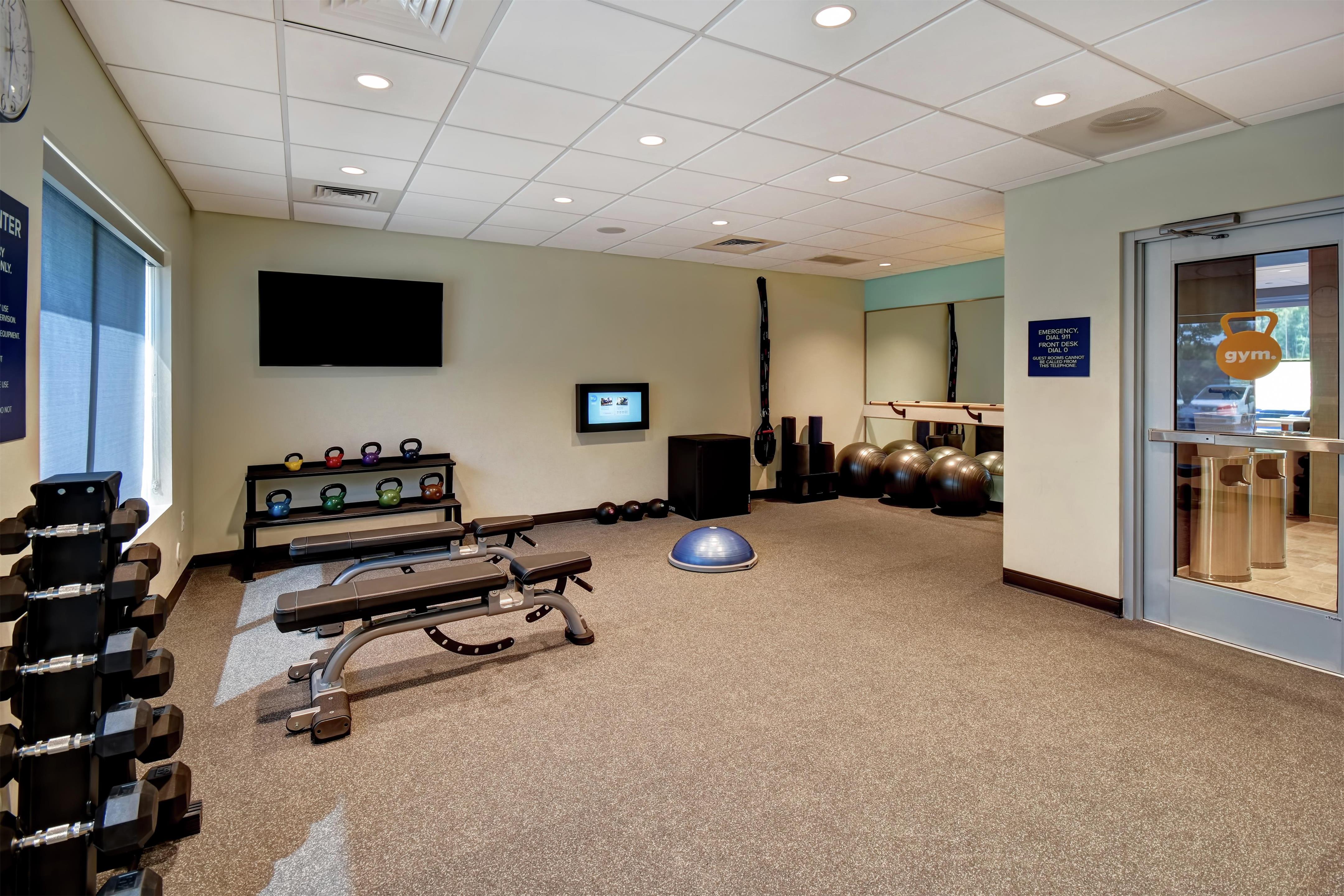 Health club fitness center gym | Tru by Hilton Raleigh Durham Airport