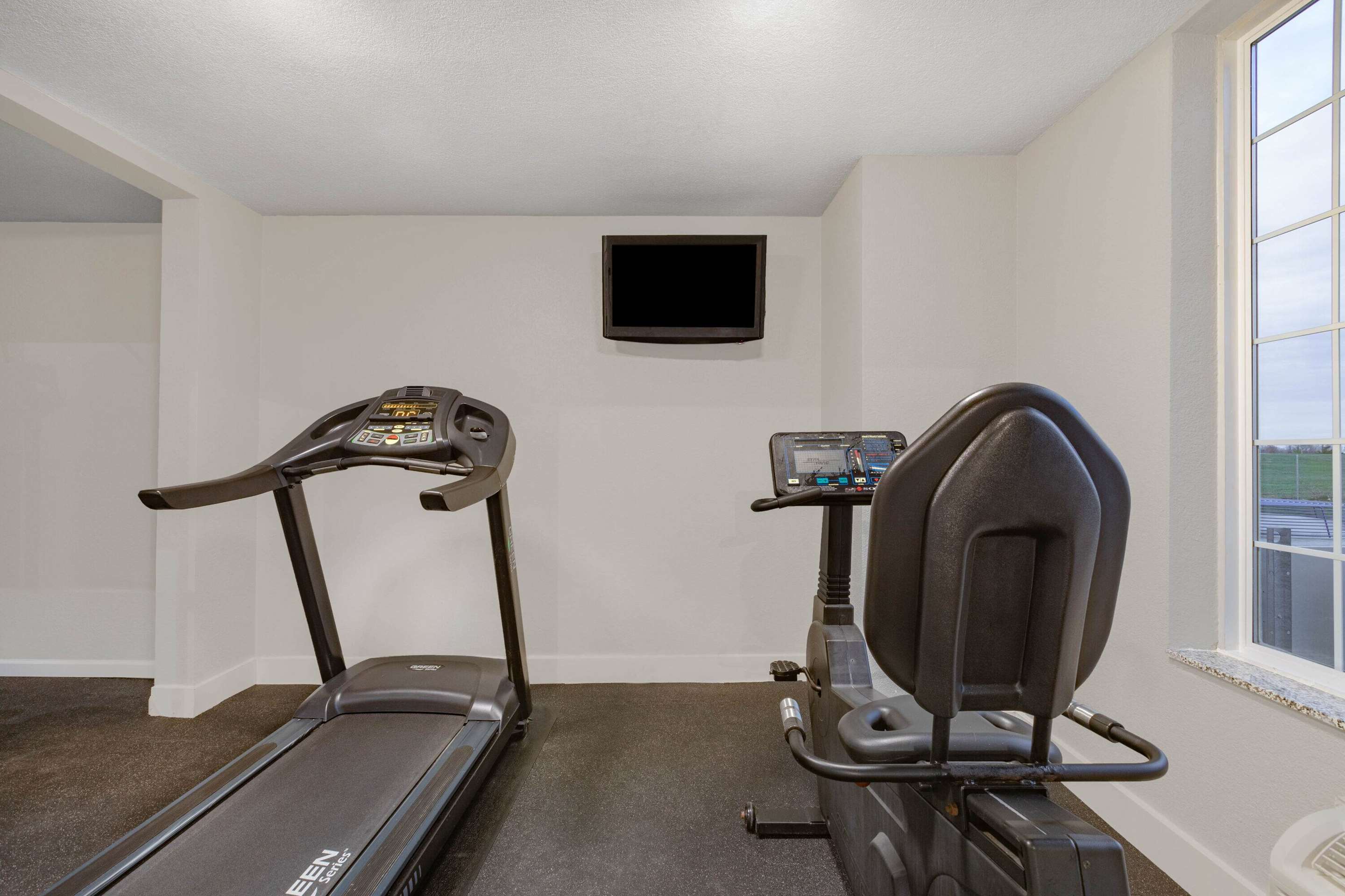 Health club fitness center gym | AmericInn by Wyndham Pella
