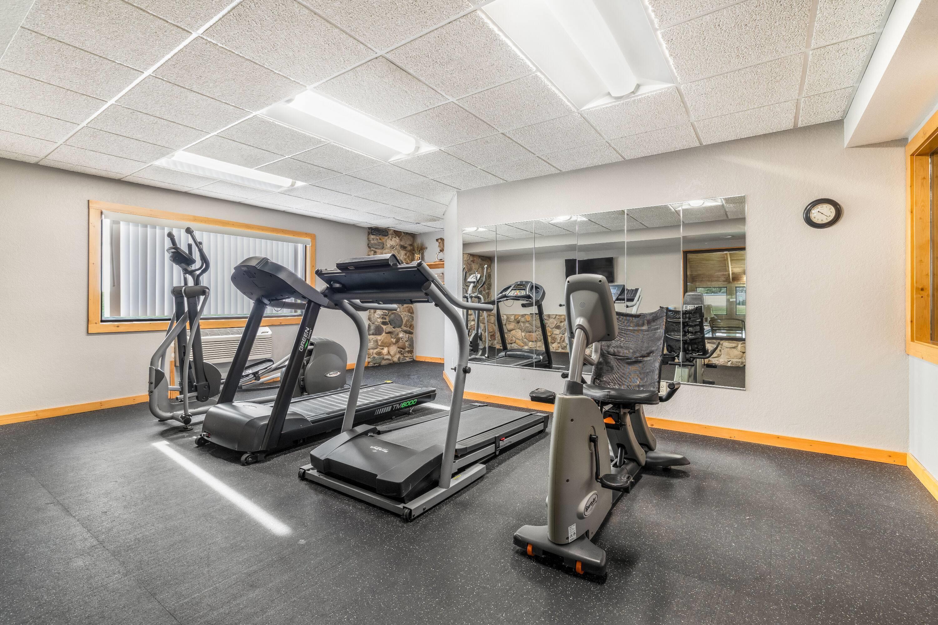 Health club fitness center gym | AmericInn by Wyndham Chamberlain - Conference Center
