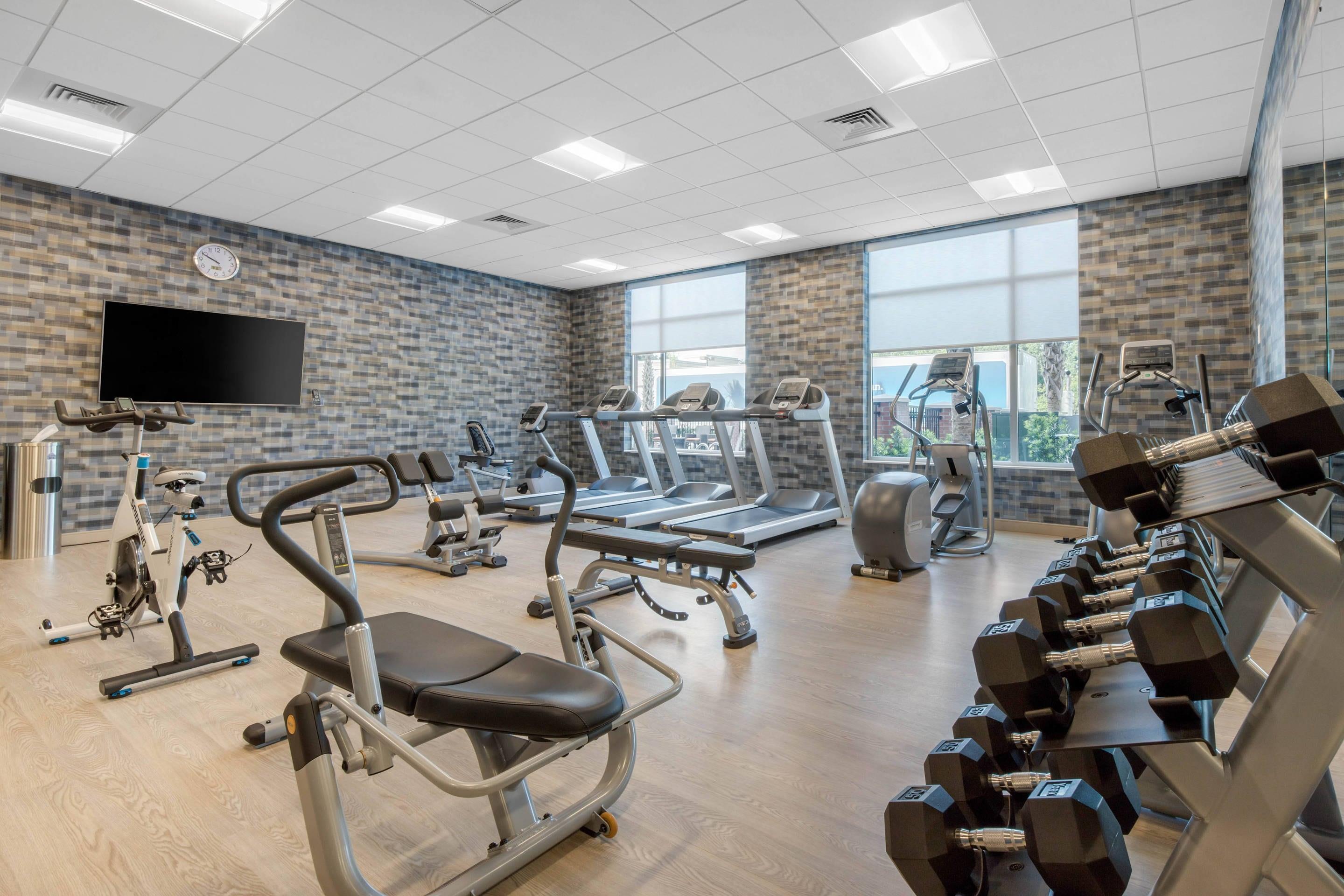 Exercise room with cardio equipment and weights | Cambria Hotel Mount Pleasant - Charleston