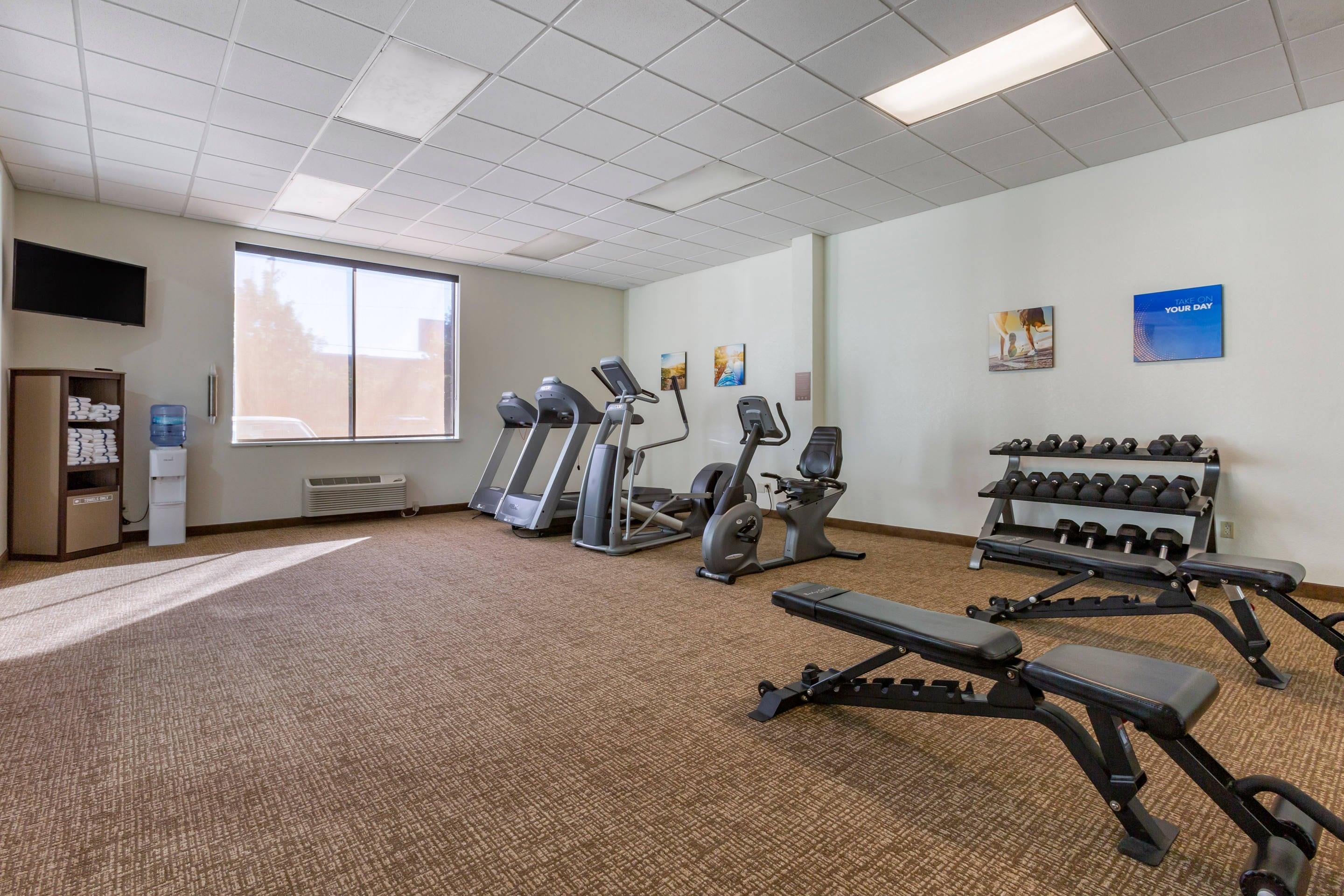 Exercise room with cardio equipment and weights | MainStay Suites I-90 City Center