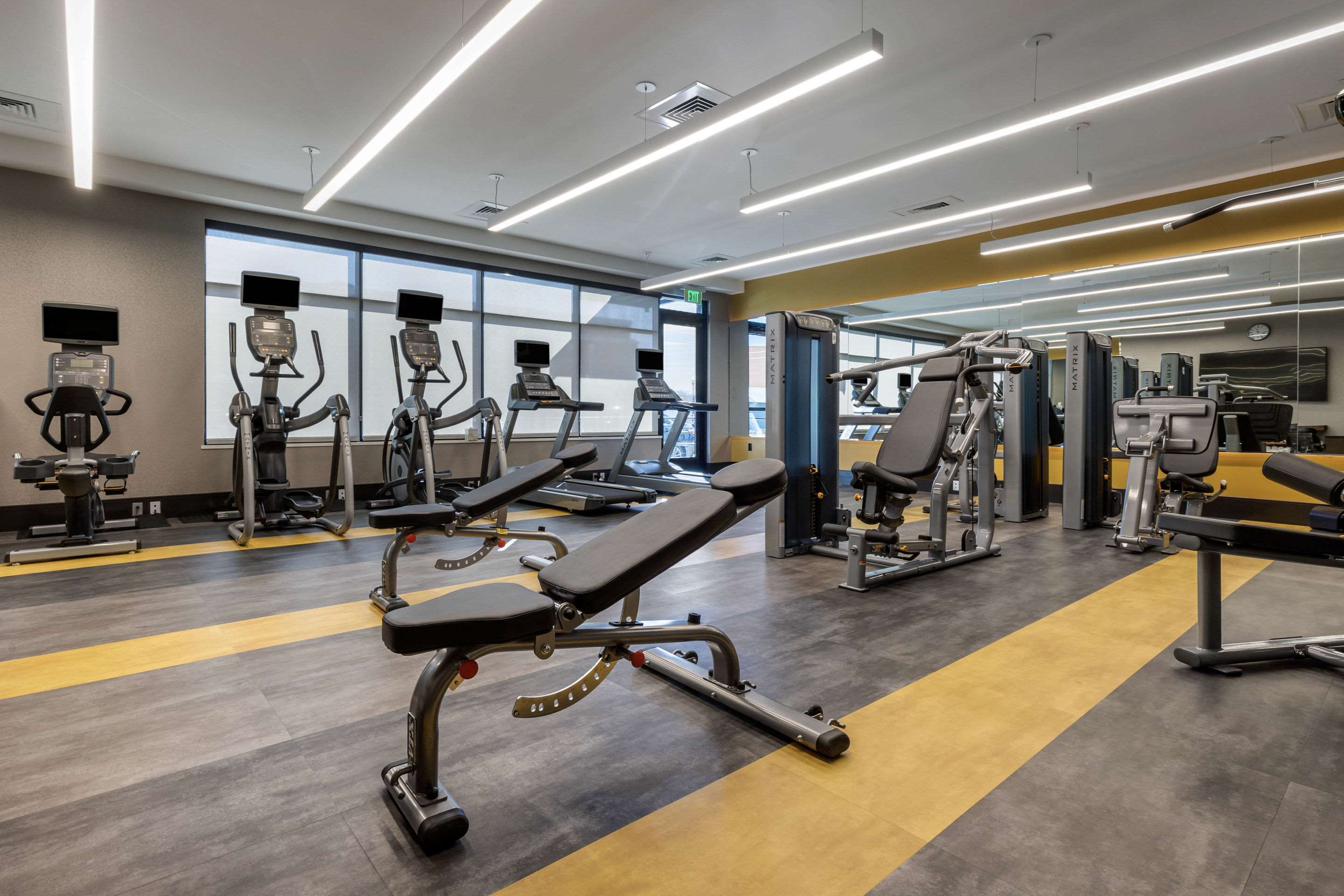 Exercise room with cardio equipment and weights | Cambria Hotel Arundel Mills - BWI Airport