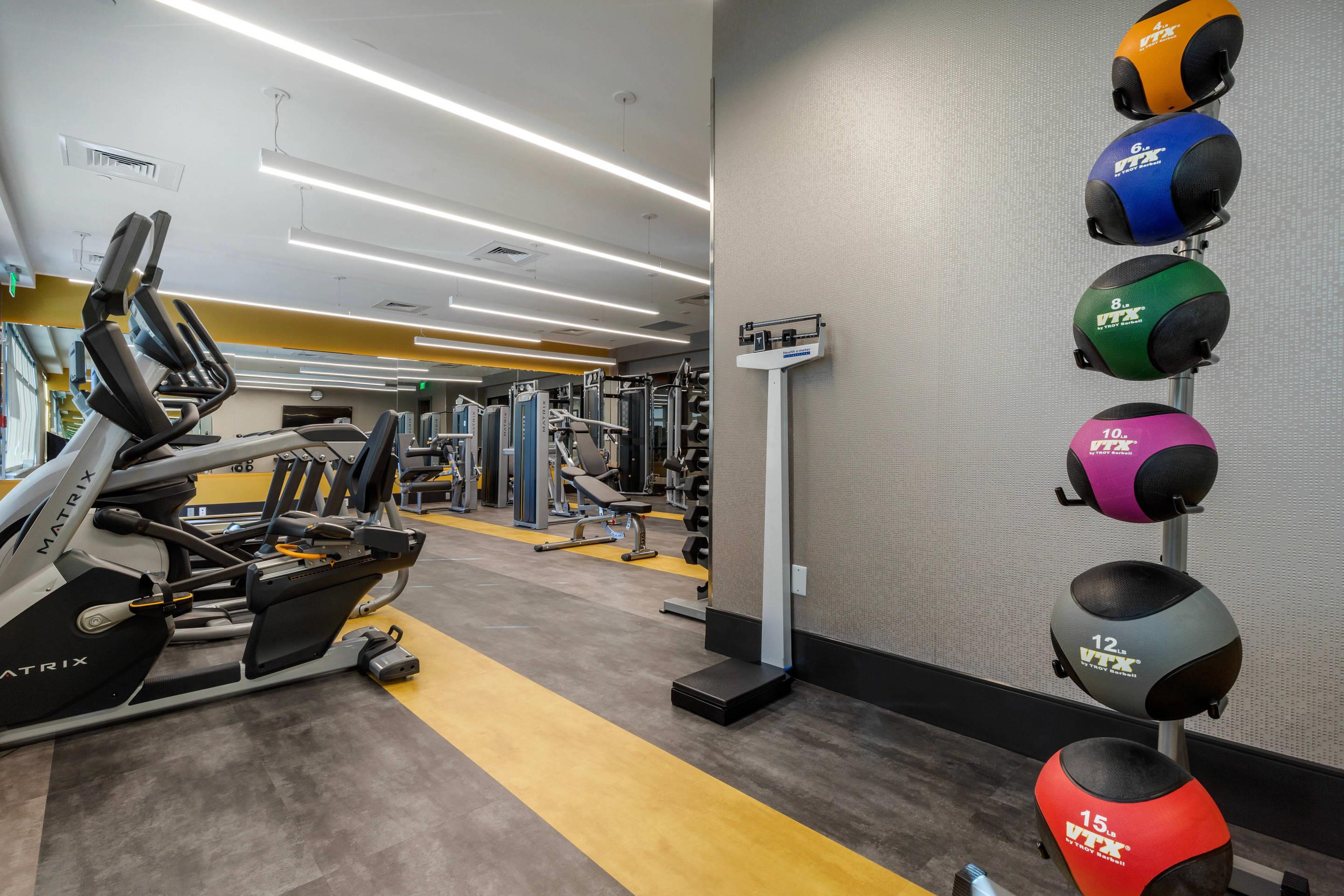 Exercise room with cardio equipment and weights | Cambria Hotel Arundel Mills - BWI Airport
