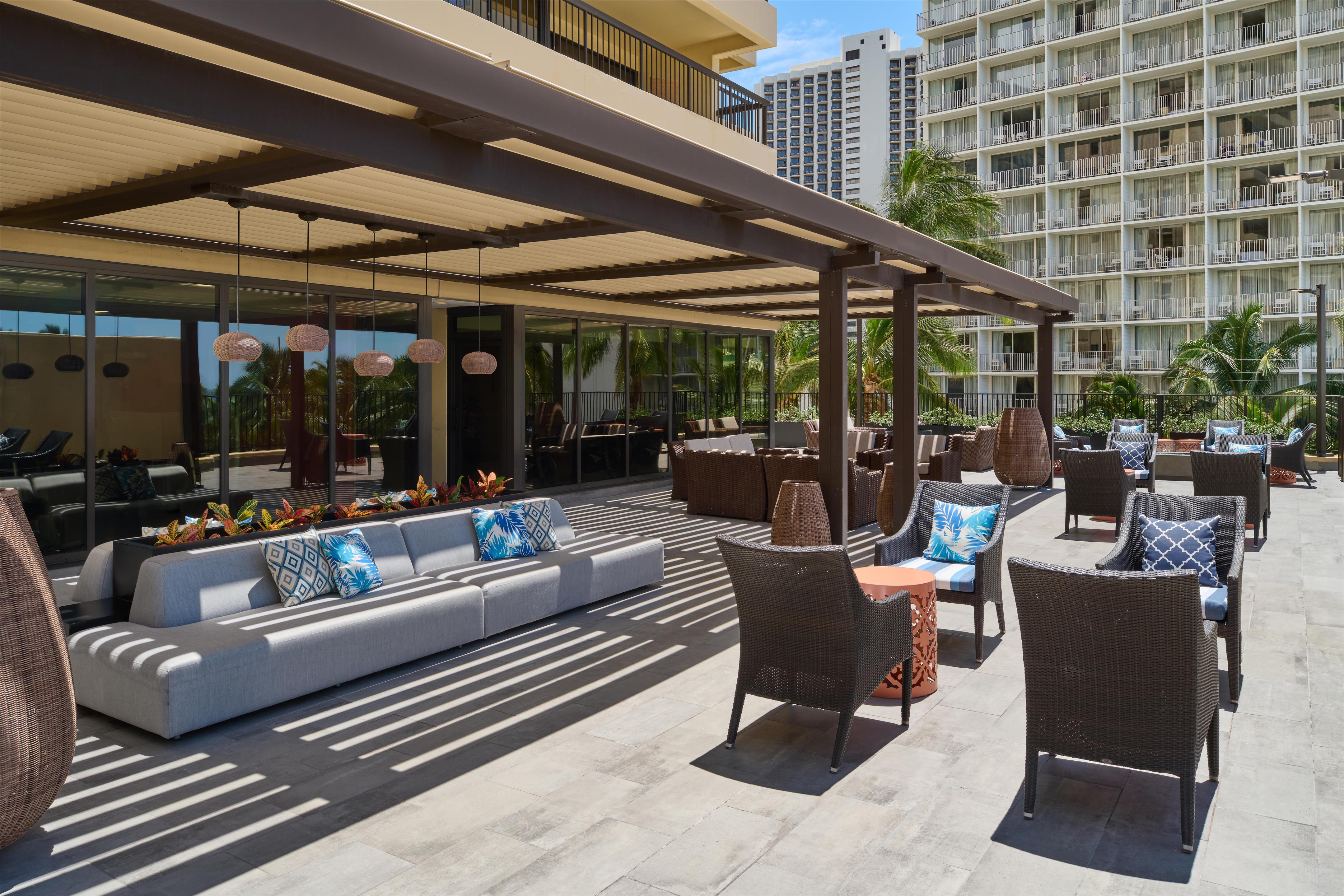 Aston Waikiki Beach Tower - 4th Floor Deck Seating Area | Aston Waikiki Beach Hotel