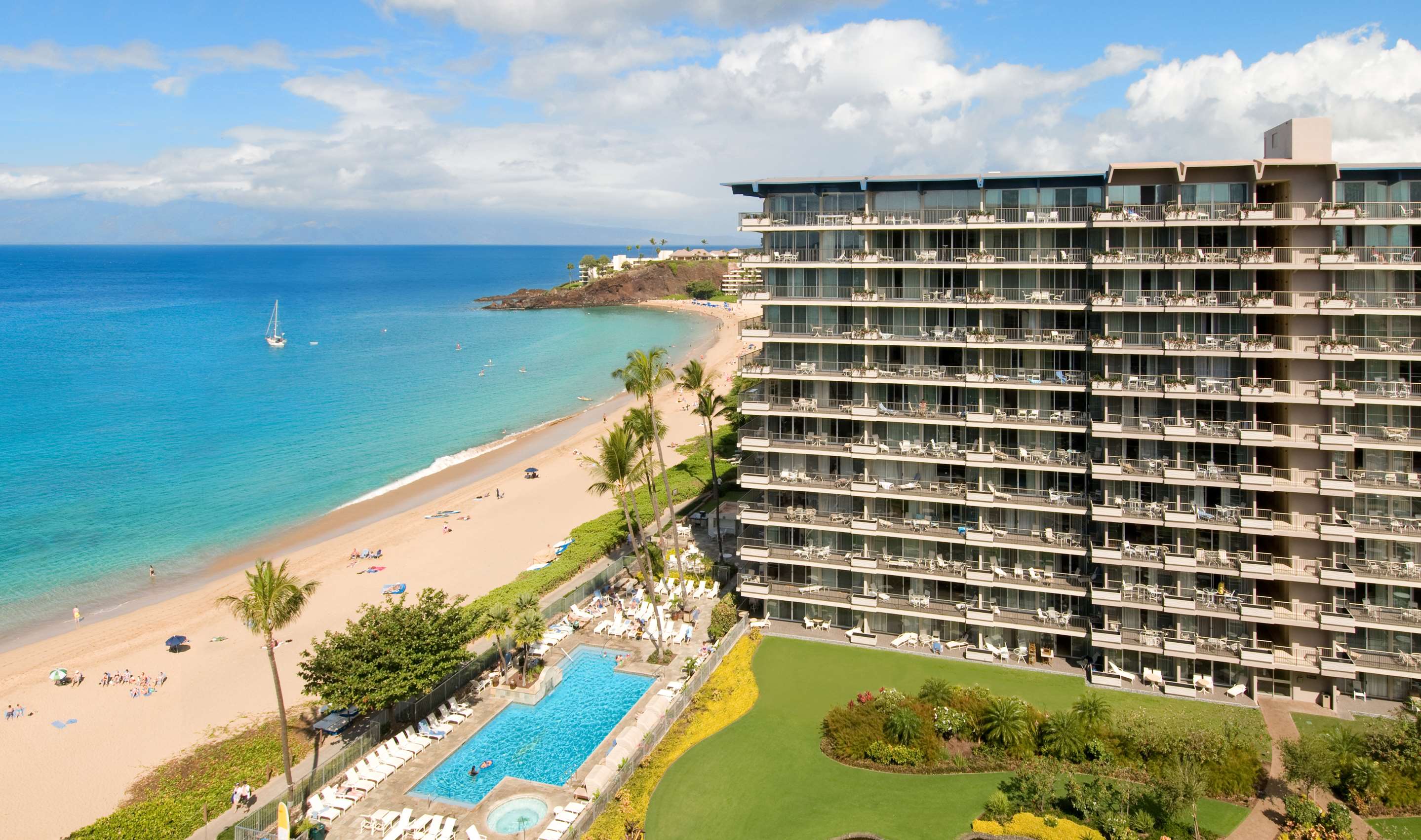 Aston at The Whaler on Kaanapali Beach - Exterior with Kaanapali Beach and Pool | Aston at The Whaler on Kaanapali Beach