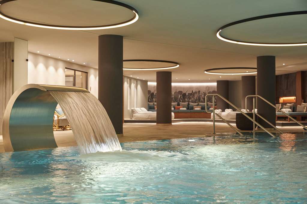 Infinity Hotel and Conference-guestroom-Guest Room,Guest Room Amenity,Pool,Architecture,Indoor/Interior,On-Site,Outdoor/Exterior,Property Amenity,Recreation,Summer,Exterior View of Building.jpg