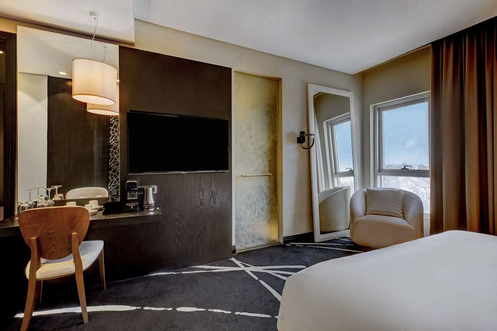 RADISSON BLU HOTEL LAGOS IKEJA-guestroom-Amenities,Bedding,King bed,Coffee/tea facilities,TV and multimedia,Living Area,Family Travel,Luxury Travel,Romantic Getaways,Single Parent Travel,Adults,Black/African,Family,Single/Unmarried,Single Parent,View from property,Telephone,Double Room,Single Room,Standard Room,Seating,Family.jpg