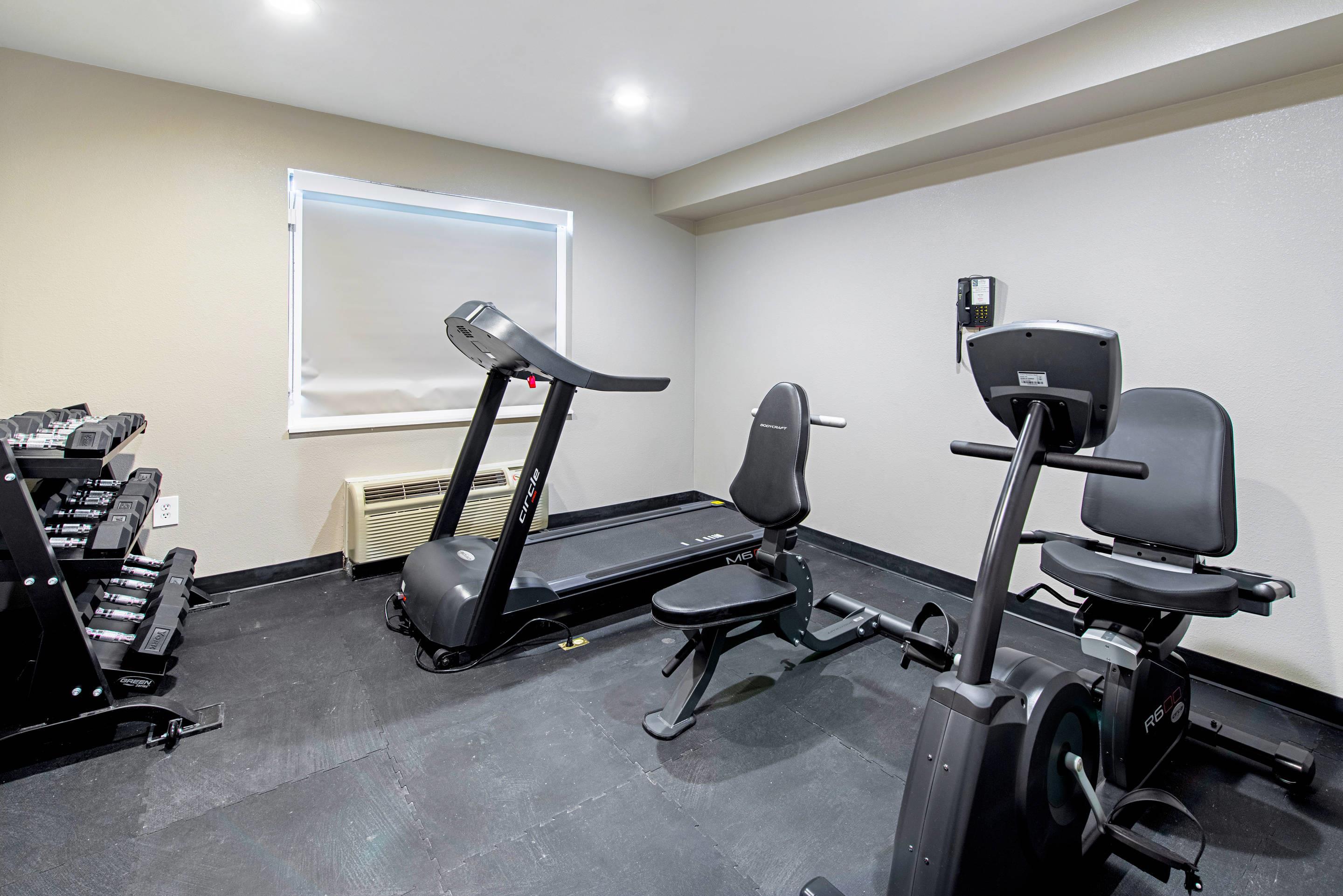 Exercise room with cardio equipment and weights | Quality Inn Mishawaka near Notre Dame